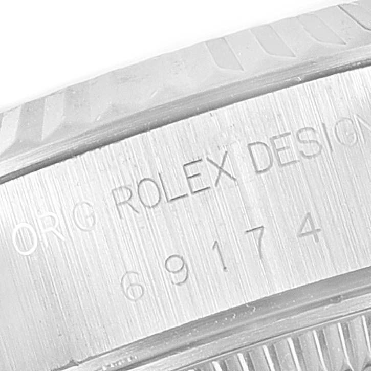 The image shows a close-up of the case back with engravings of the Rolex Datejust 69174 Women
s Stainless Steel Silver Dial 69174 Women
s Stainless Steel Silver Dial model.