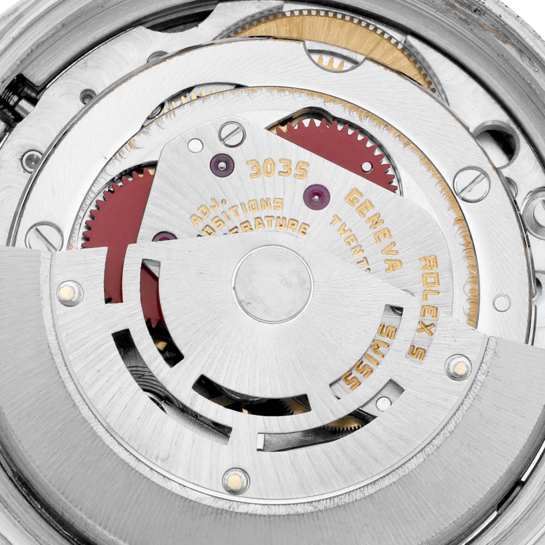 The image shows a close-up of the movement inside a Vintage Collection Rolex watch, highlighting the gears and inner mechanisms.