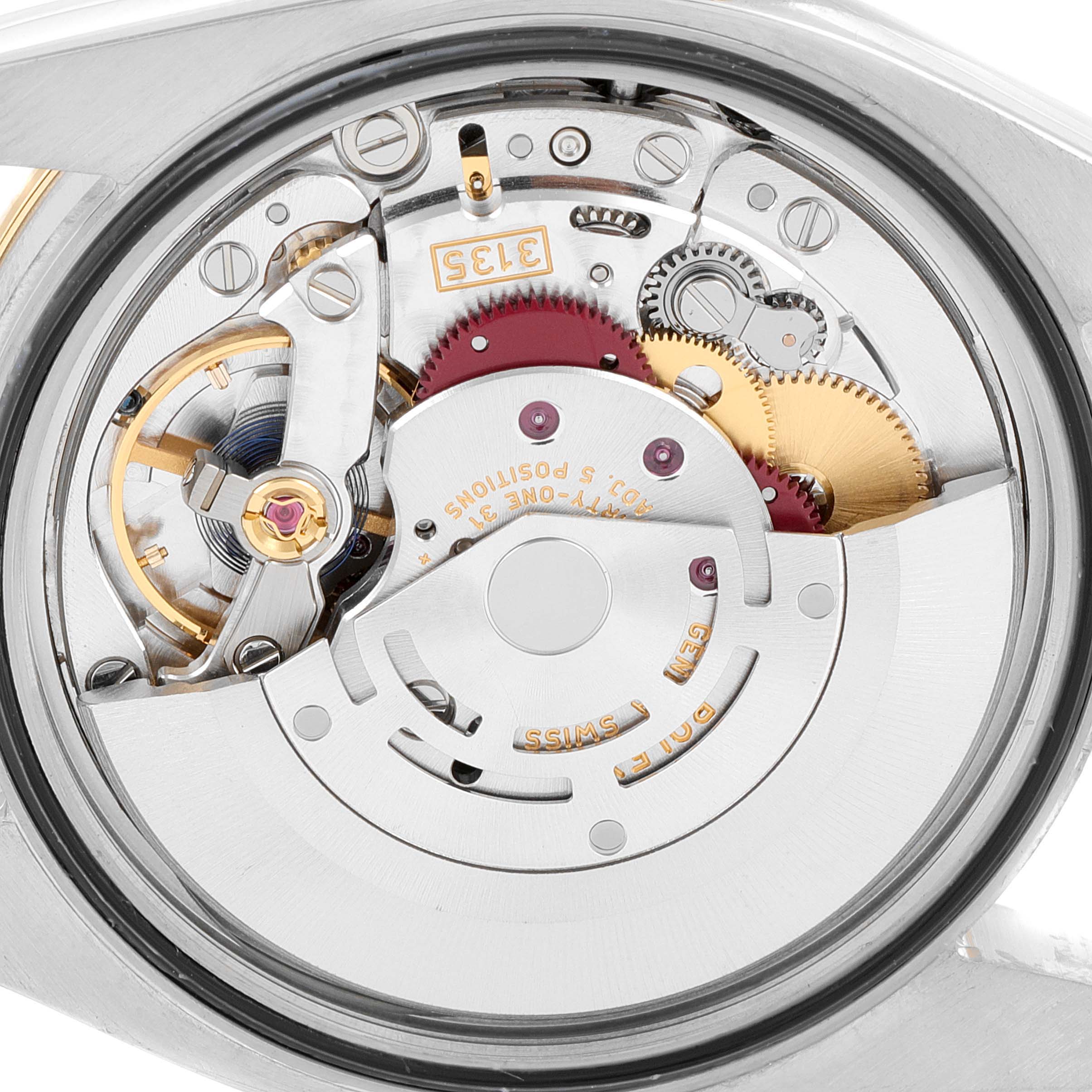 The image shows a close-up view of the mechanical movement and components inside a Rolex Datejust 116243 Men's Steel and Gold (two tone) Silver Dial 116243 Men's Steel and Gold (two tone) Silver Dial watch.