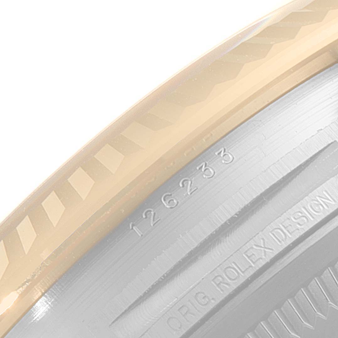 This image shows a close-up angle of the bezel and part of the case of a Rolex Datejust 126233 Men
s Steel and Gold (two tone) Grey Dial 126233 Men
s Steel and Gold (two tone) Grey Dial watch, with visible model and design markings.