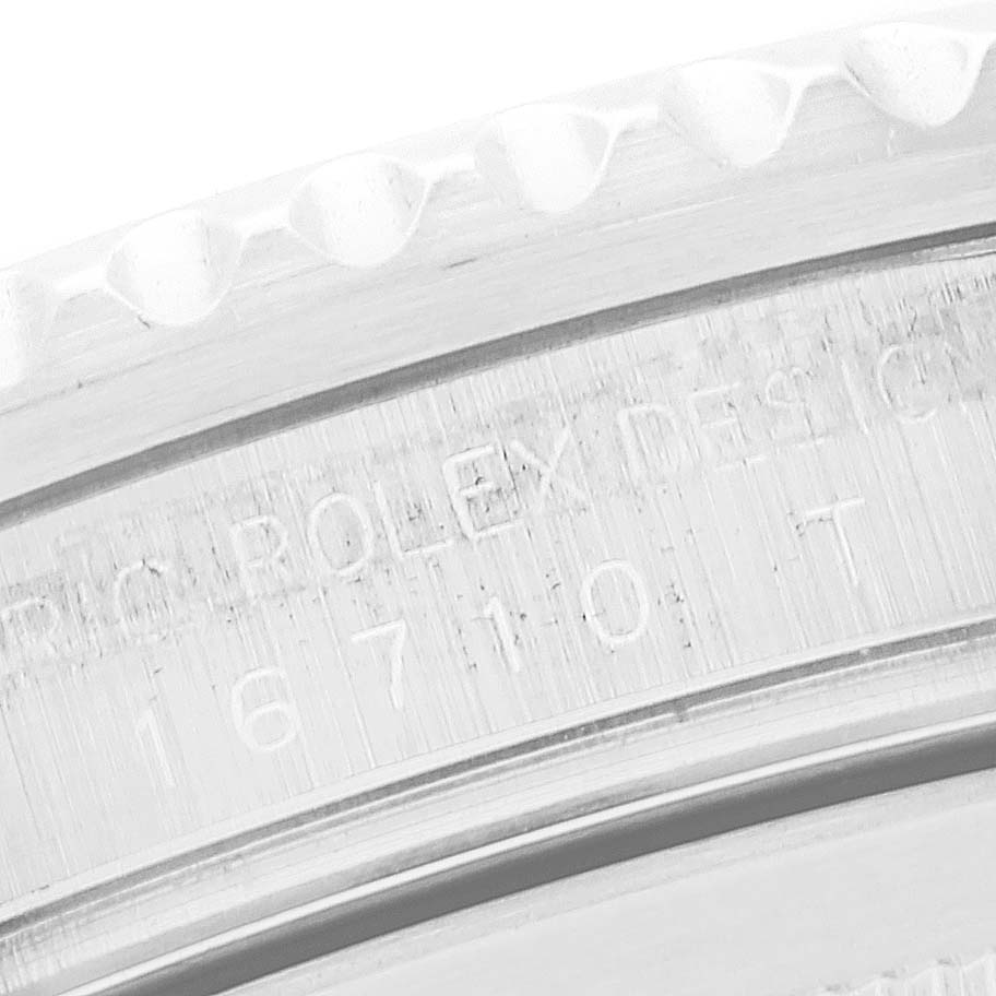 This image shows a close-up of the engraved inner bezel and rim of the Rolex GMT-Master 16710 Men's Stainless Steel Black Dial 16710 Men's Stainless Steel Black Dial watch casing.