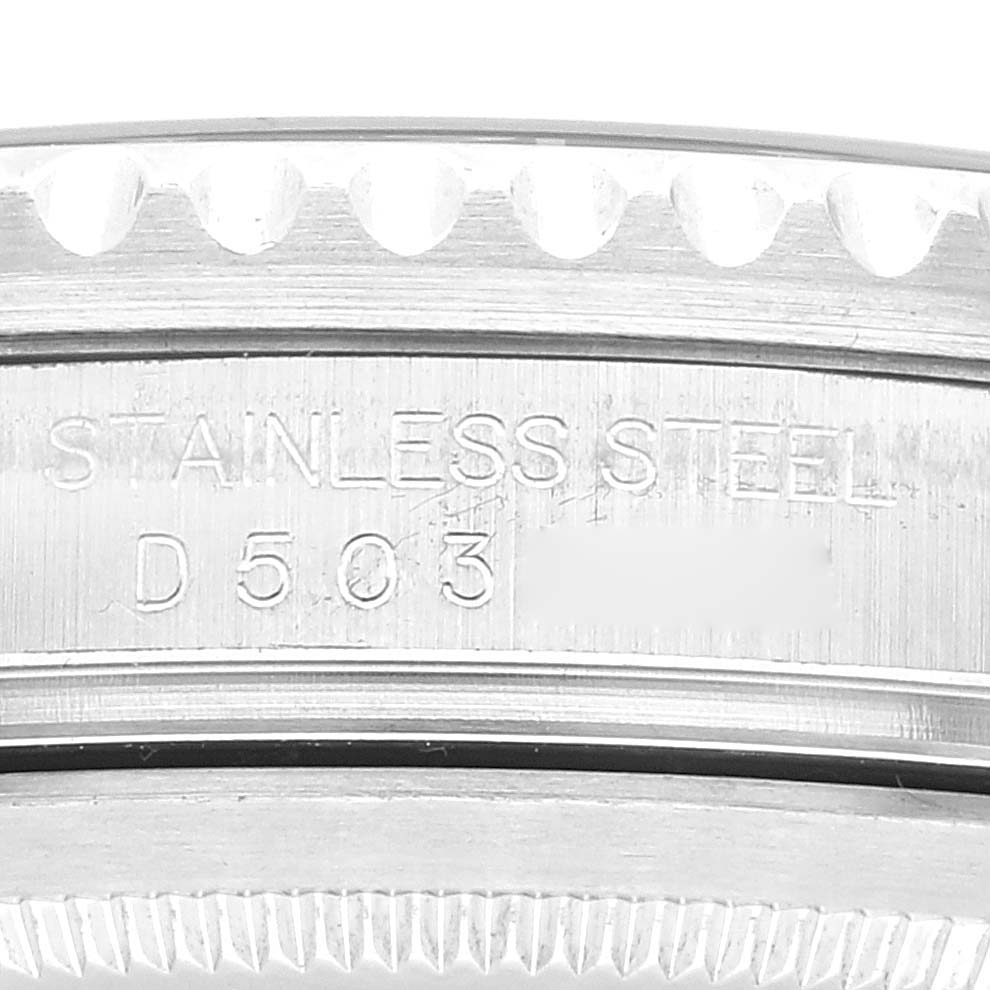 The image shows a close-up of the side of a Rolex GMT-Master 16710 Men's Stainless Steel Black Dial 16710 Men's Stainless Steel Black Dial watch, highlighting the stainless steel casing and serial number.