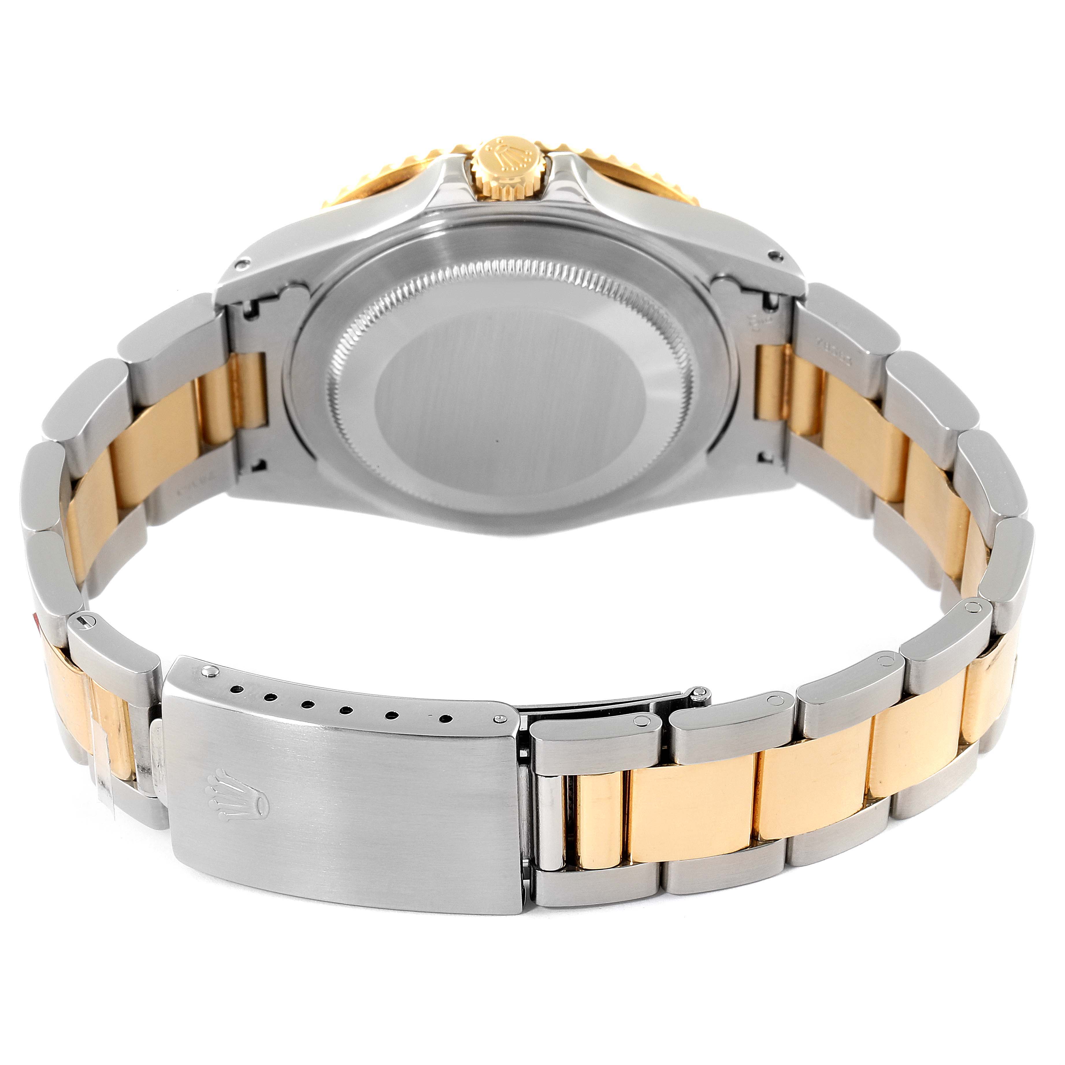 This image shows the back view of the Rolex GMT-Master 16713 Men's Steel and Gold (two tone) Brown Dial 16713 Men's Steel and Gold (two tone) Brown Dial watch, highlighting the case back, clasp, and two-tone bracelet.