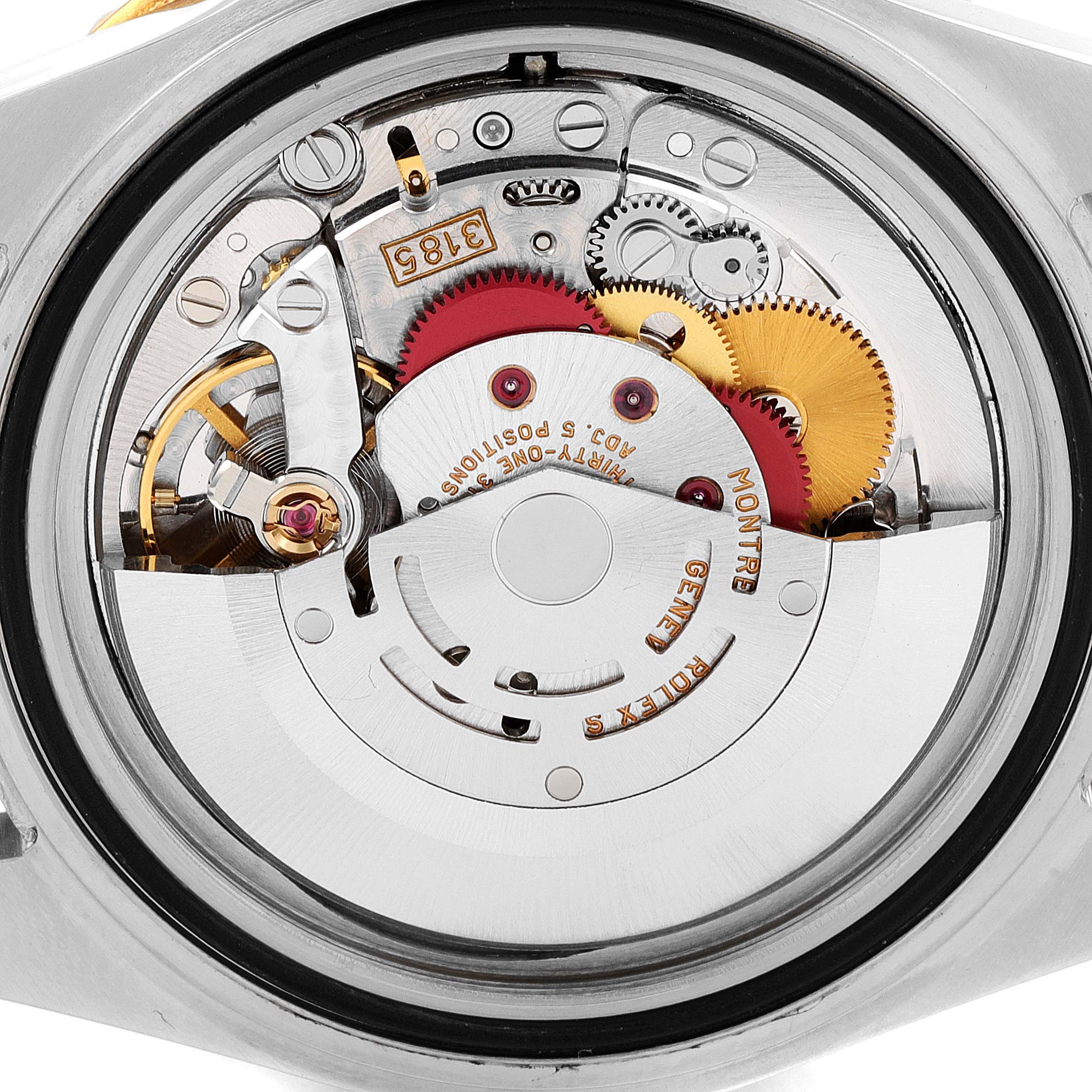 This image shows the inner mechanical movement of a Rolex GMT-Master 16713 Men's Steel and Gold (two tone) Brown Dial 16713 Men's Steel and Gold (two tone) Brown Dial watch, displaying gears and intricate components.