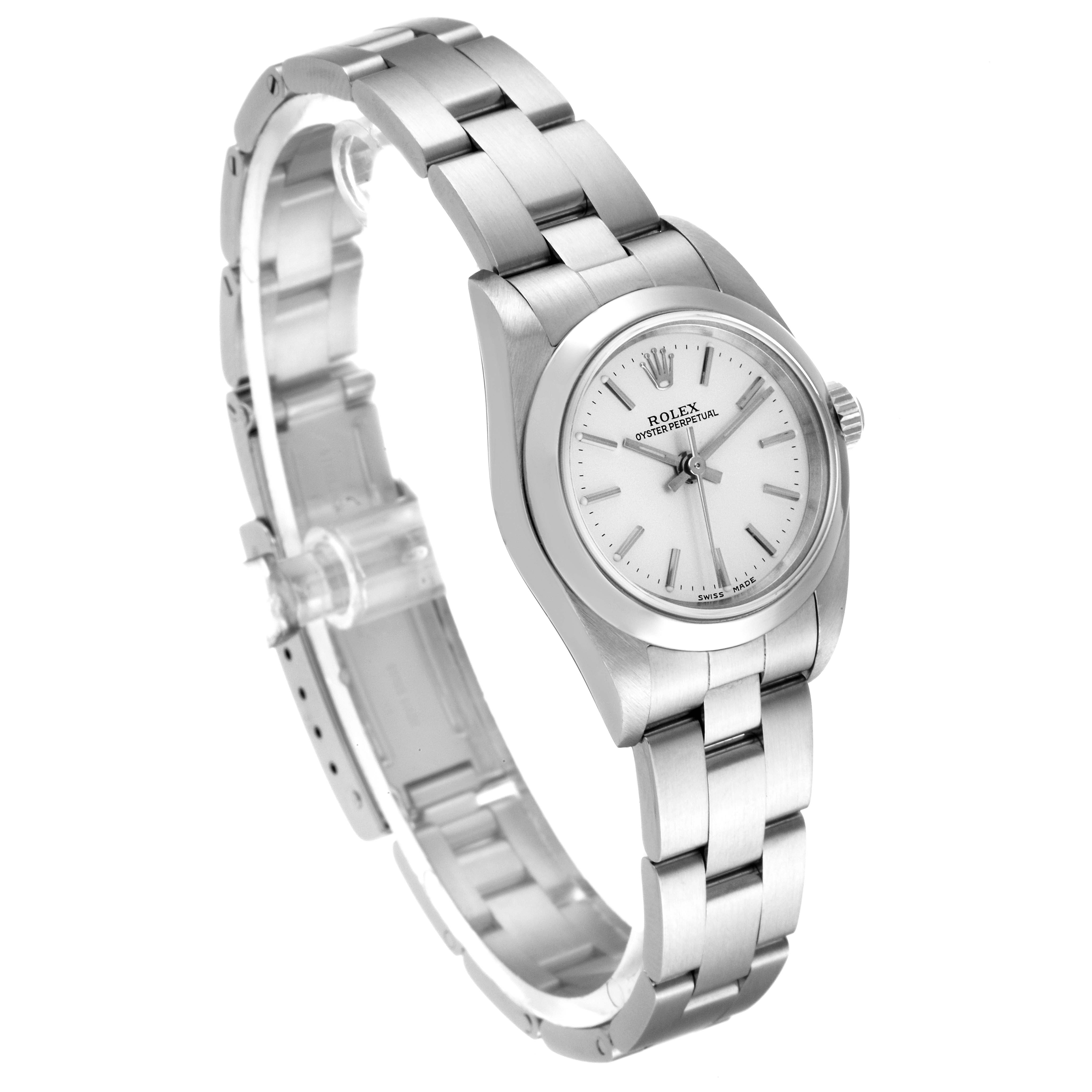 The Rolex Oyster Perpetual 76080 Women's Stainless Steel Silver Dial 76080 Women's Stainless Steel Silver Dial watch is shown from an angled side view, displaying its face, crown, and metallic bracelet.