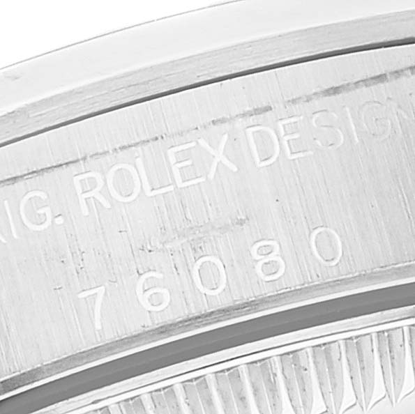 The image shows a close-up of the case back with engravings on a Rolex Oyster Perpetual 76080 Women's Stainless Steel Silver Dial 76080 Women's Stainless Steel Silver Dial watch.