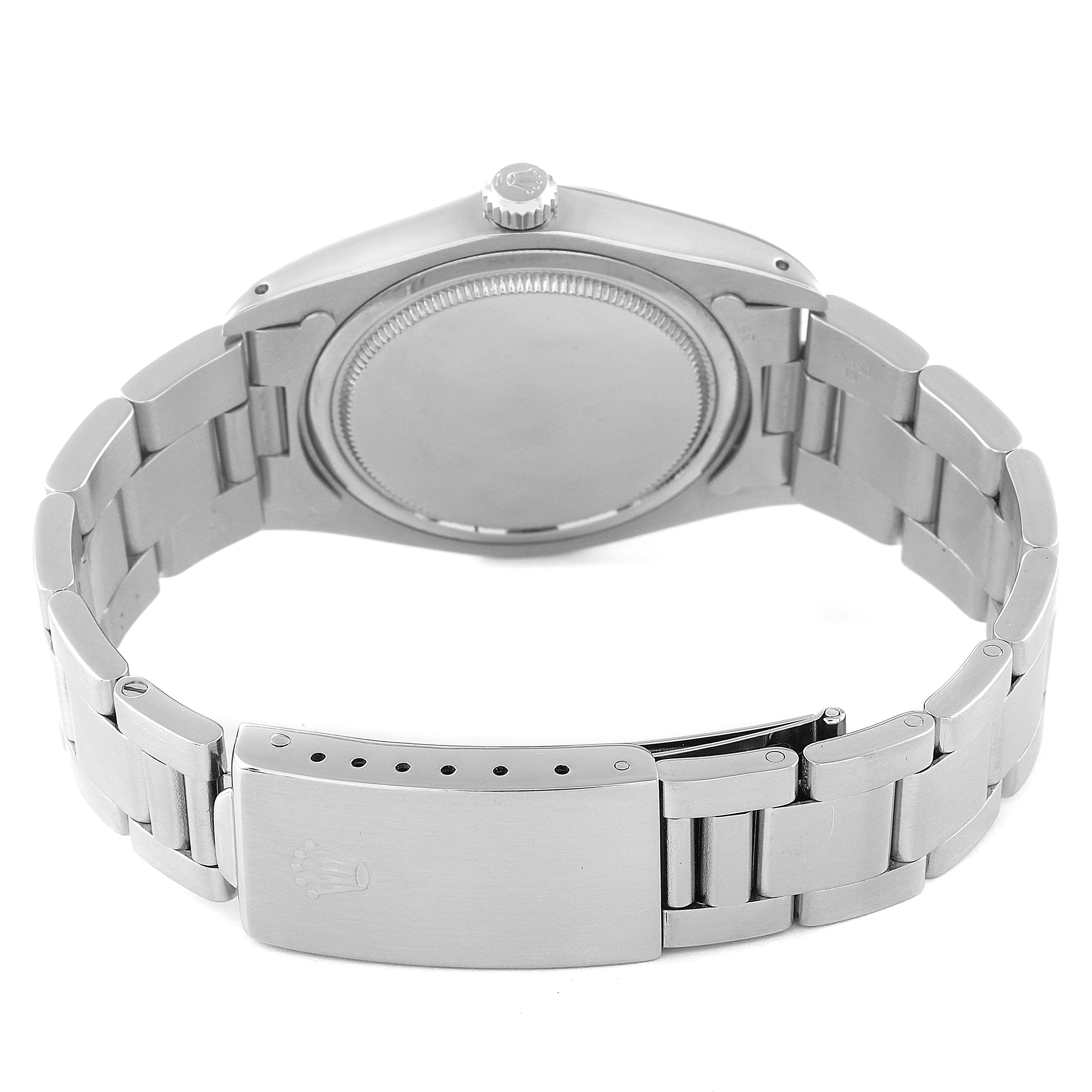 This image shows the back case, crown, and bracelet of a Vintage Collection Rolex watch.