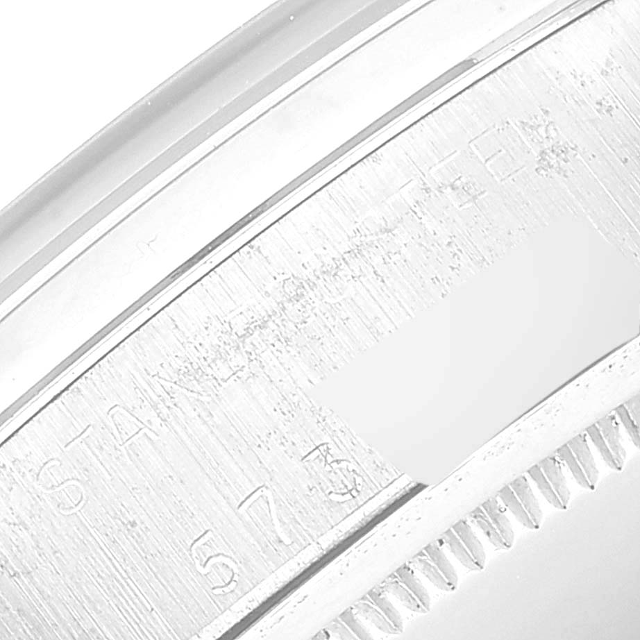 This image shows a close-up view of the engraved edge on the bezel of a Rolex Vintage Collection 6694 Men
s Stainless Steel Silver Dial 6694 Men
s Stainless Steel Silver Dial watch.