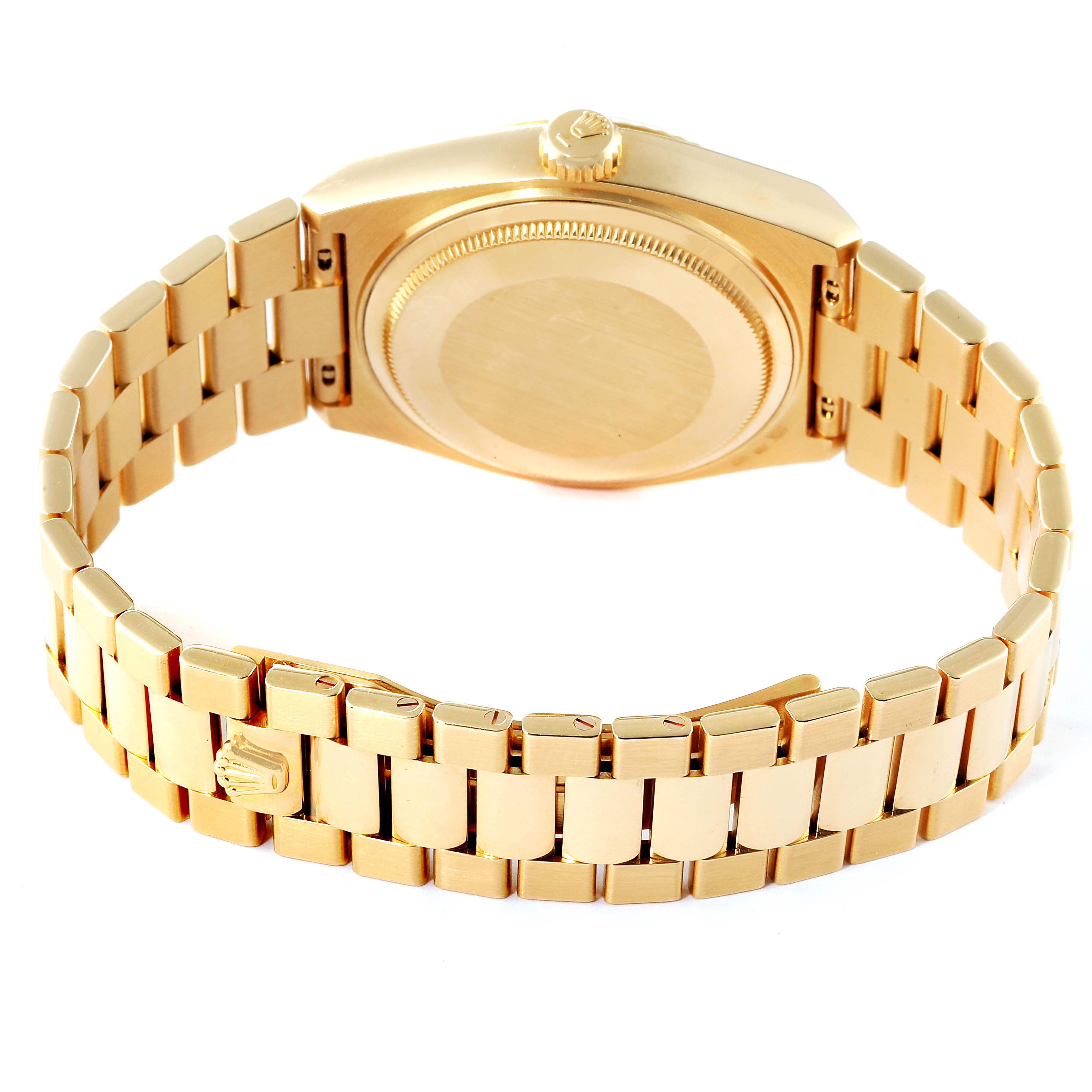 The image shows the back side of a Rolex Oysterquartz 19018 Men's Yellow Gold Champagne Dial 19018 Men's Yellow Gold Champagne Dial watch and its gold bracelet.