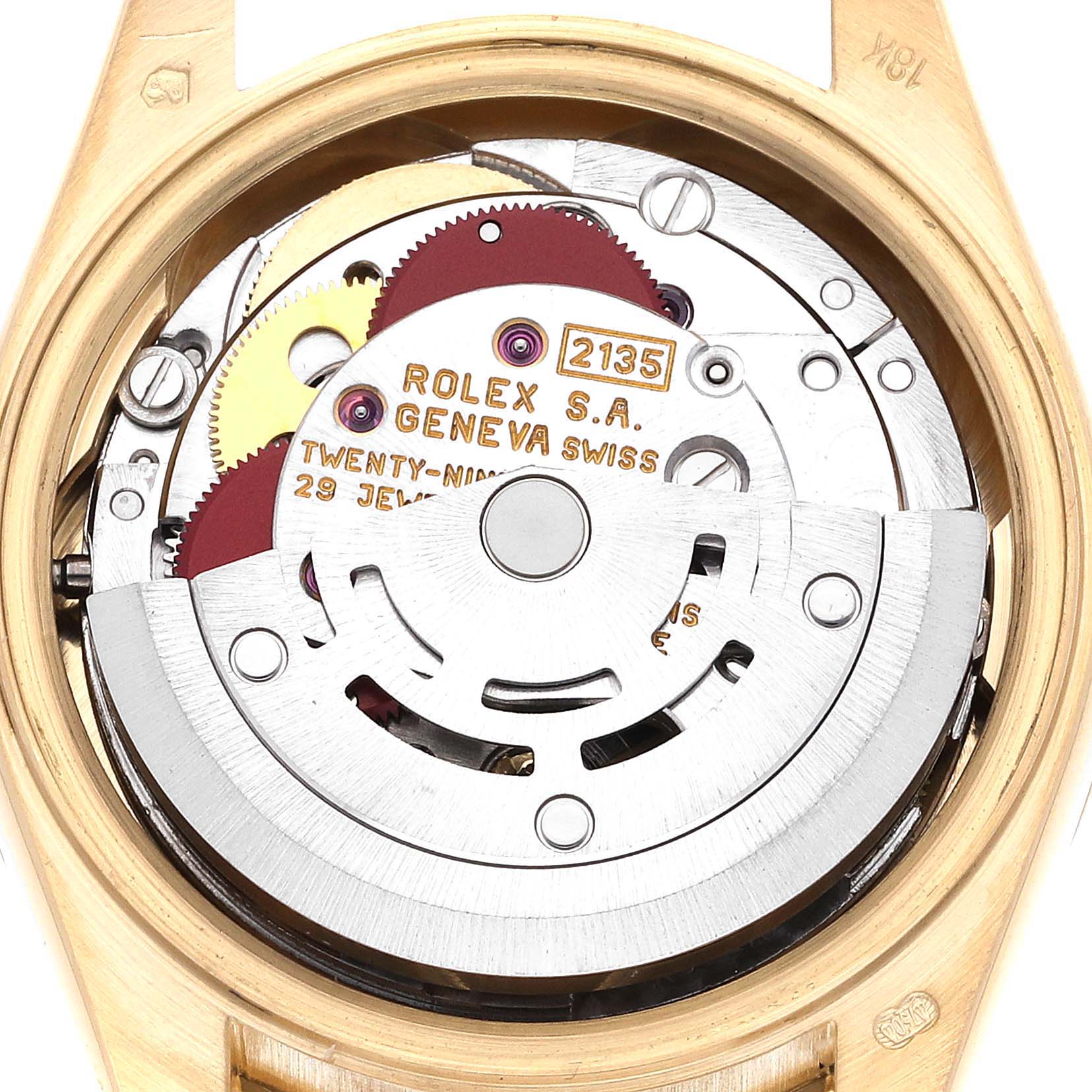 This image shows the inner mechanism of a Rolex President 69288 Women's Yellow Gold Champagne Dial 69288 Women's Yellow Gold Champagne Dial model watch, viewed from the back, revealing gears and inscriptions.