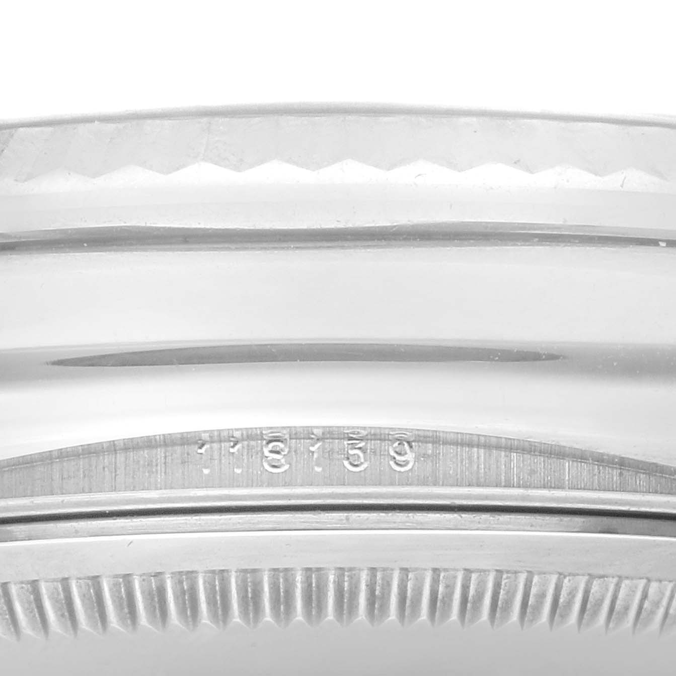 This image shows the engraved serial number on the side of the case of a Rolex President 118139 Men
s White Gold Red Dial 118139 Men
s White Gold Red Dial model watch.