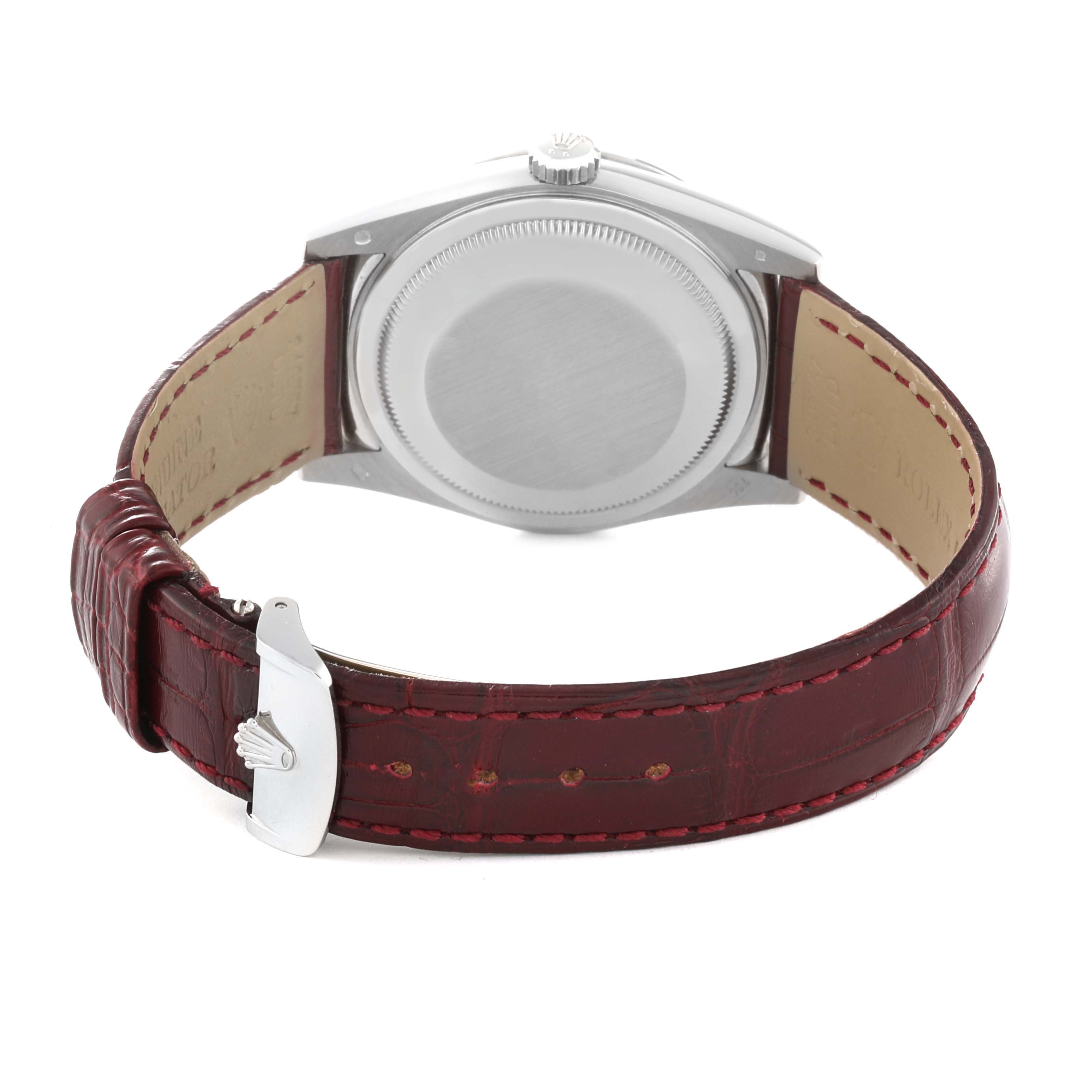 This image shows the back side of a Rolex President 118139 Men
s White Gold Red Dial 118139 Men
s White Gold Red Dial watch, focusing on the case, crown, and leather strap with buckle.