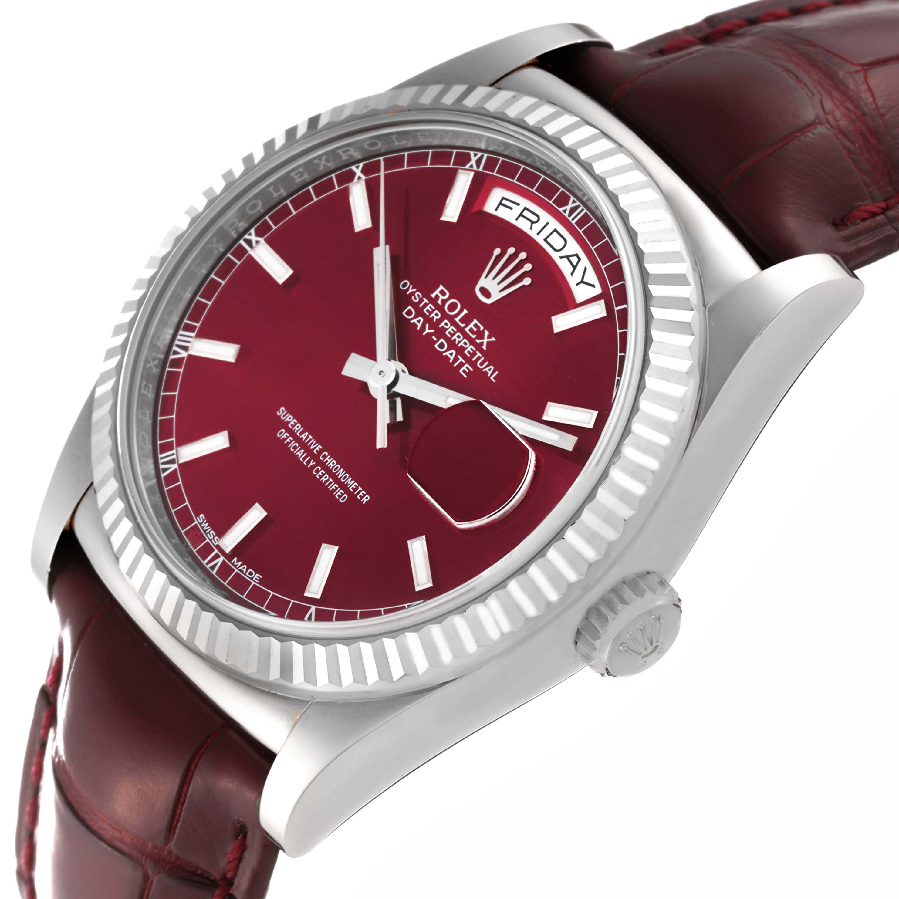 This image shows a Rolex President 118139 Men
s White Gold Red Dial 118139 Men
s White Gold Red Dial model watch from an angled close-up view, focusing on its red dial, bezel, and crown.
