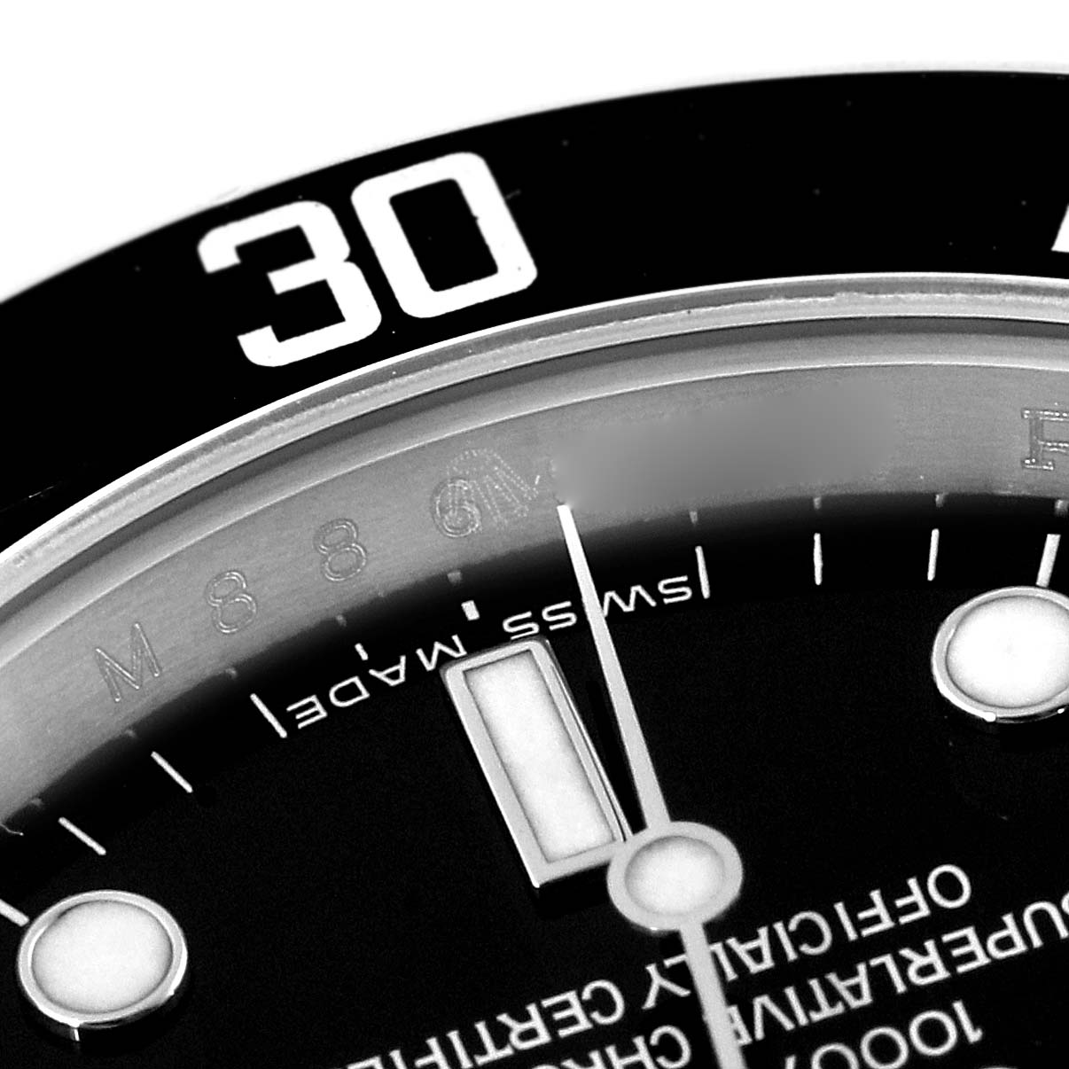 This image shows a close-up of the bezel and dial of a Rolex Submariner 14060M Men
s Stainless Steel Black Dial 14060M Men
s Stainless Steel Black Dial watch, focusing on the 30-minute mark.