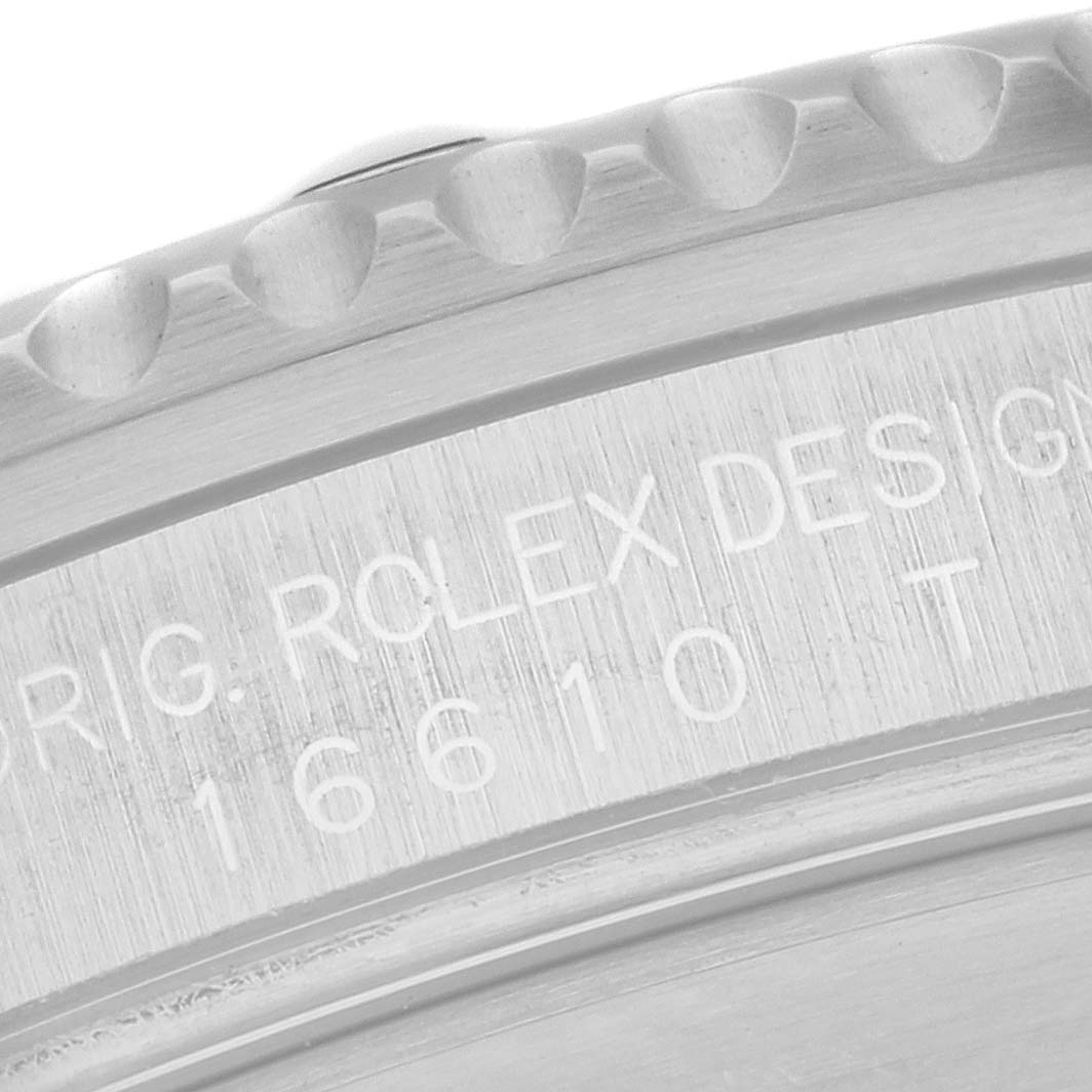 This image shows a close-up of the edge and engraved case back of a Rolex Submariner 16610 Men
s Stainless Steel Black Dial 16610 Men
s Stainless Steel Black Dial watch.