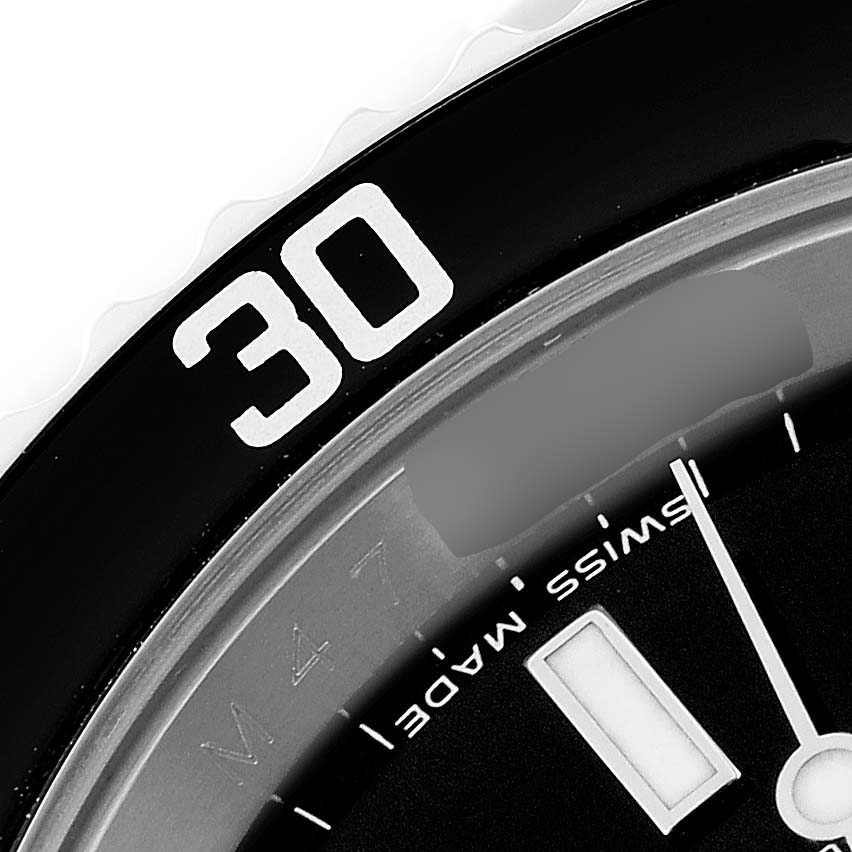 The close-up shows the bezel and a portion of the dial of a Rolex Submariner 16610 Men
s Stainless Steel Black Dial 16610 Men
s Stainless Steel Black Dial watch, including the "30" marking.