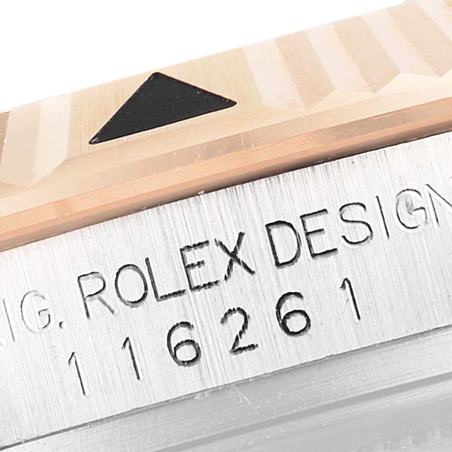 Close-up of the bezel and case side of a Rolex Turn-o-Graph 116261 Men
s Steel and Gold (two tone) Black Dial 116261 Men
s Steel and Gold (two tone) Black Dial watch, featuring the model number and inscription.