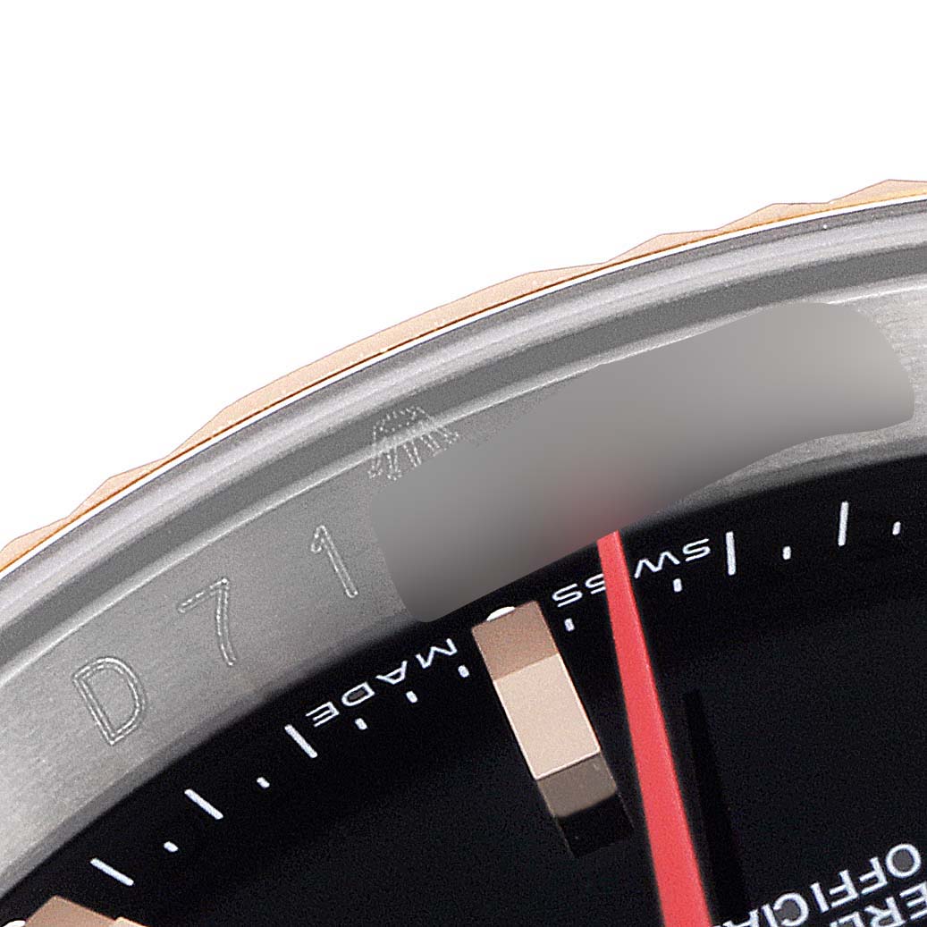 This image shows a close-up of the bezel and part of the dial of a Rolex Turn-o-Graph 116261 Men
s Steel and Gold (two tone) Black Dial 116261 Men
s Steel and Gold (two tone) Black Dial model watch.