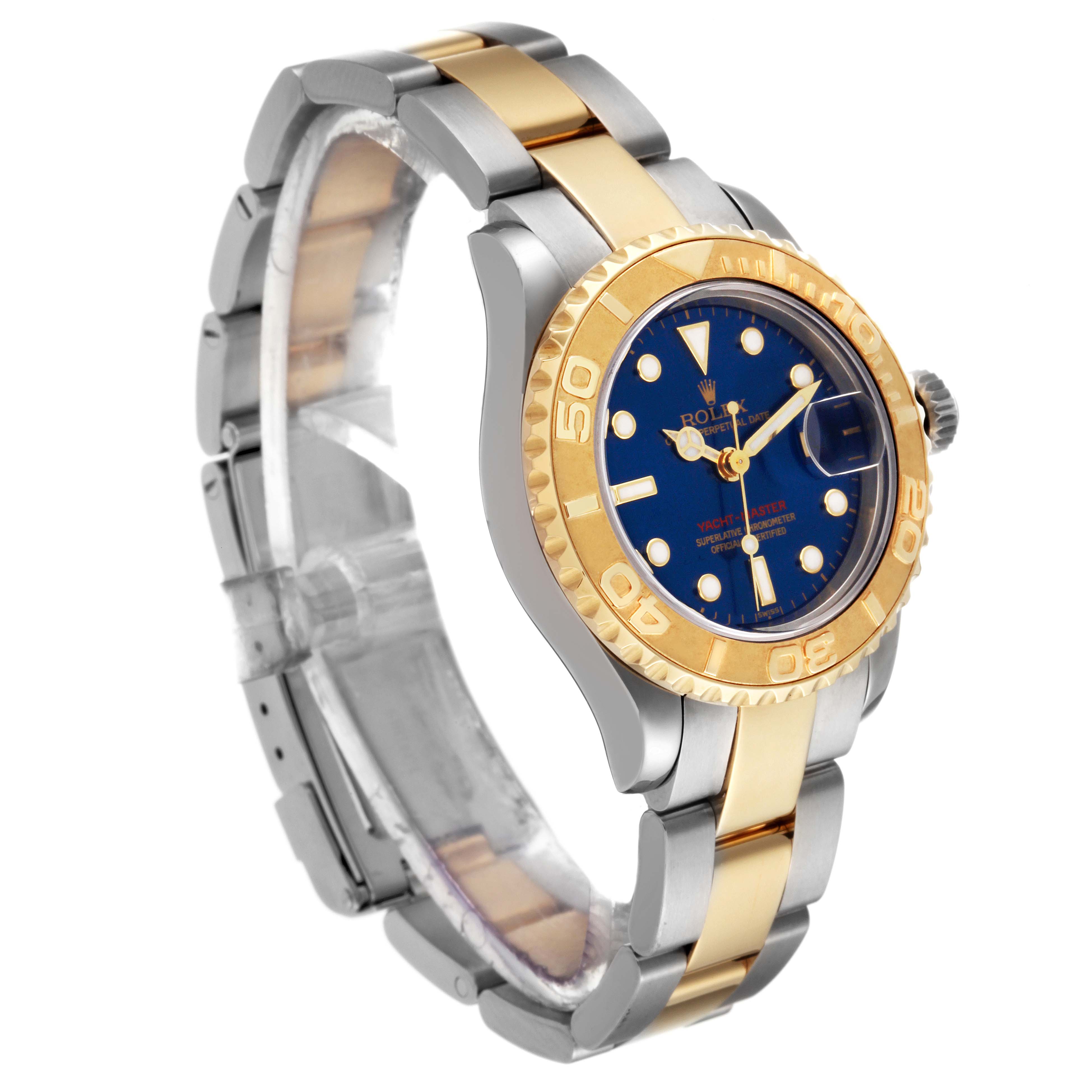 The image shows a Rolex Yacht-Master 69623 Women's Steel and Gold (two tone) Blue Dial 69623 Women's Steel and Gold (two tone) Blue Dial watch from a three-quarter angle, highlighting its two-tone bracelet, blue dial, and gold bezel.