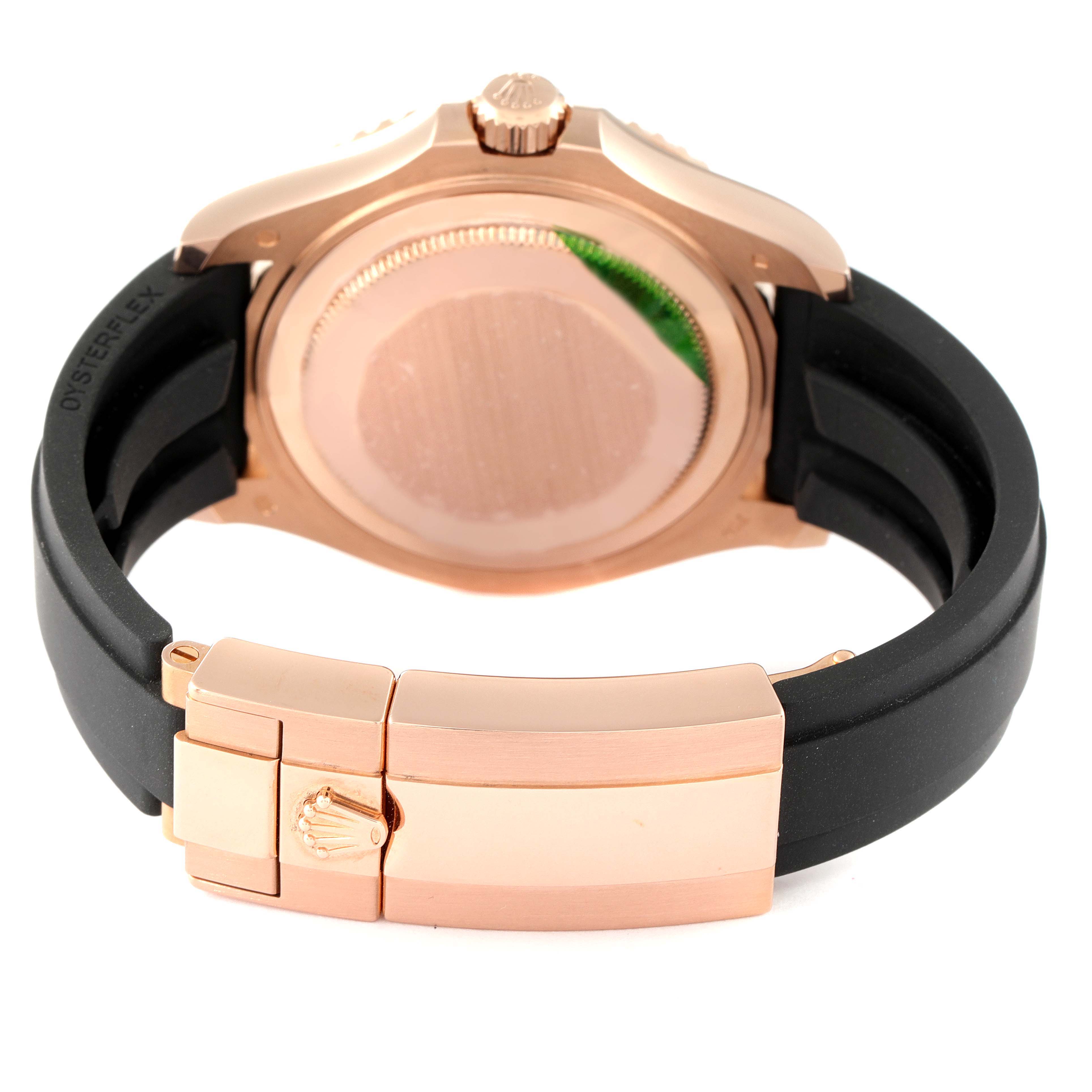 The image shows the back and clasp of a Rolex Yacht-Master 268655 Men
s Rose Gold Black Dial 268655 Men
s Rose Gold Black Dial watch, highlighting its rose gold case and black strap.