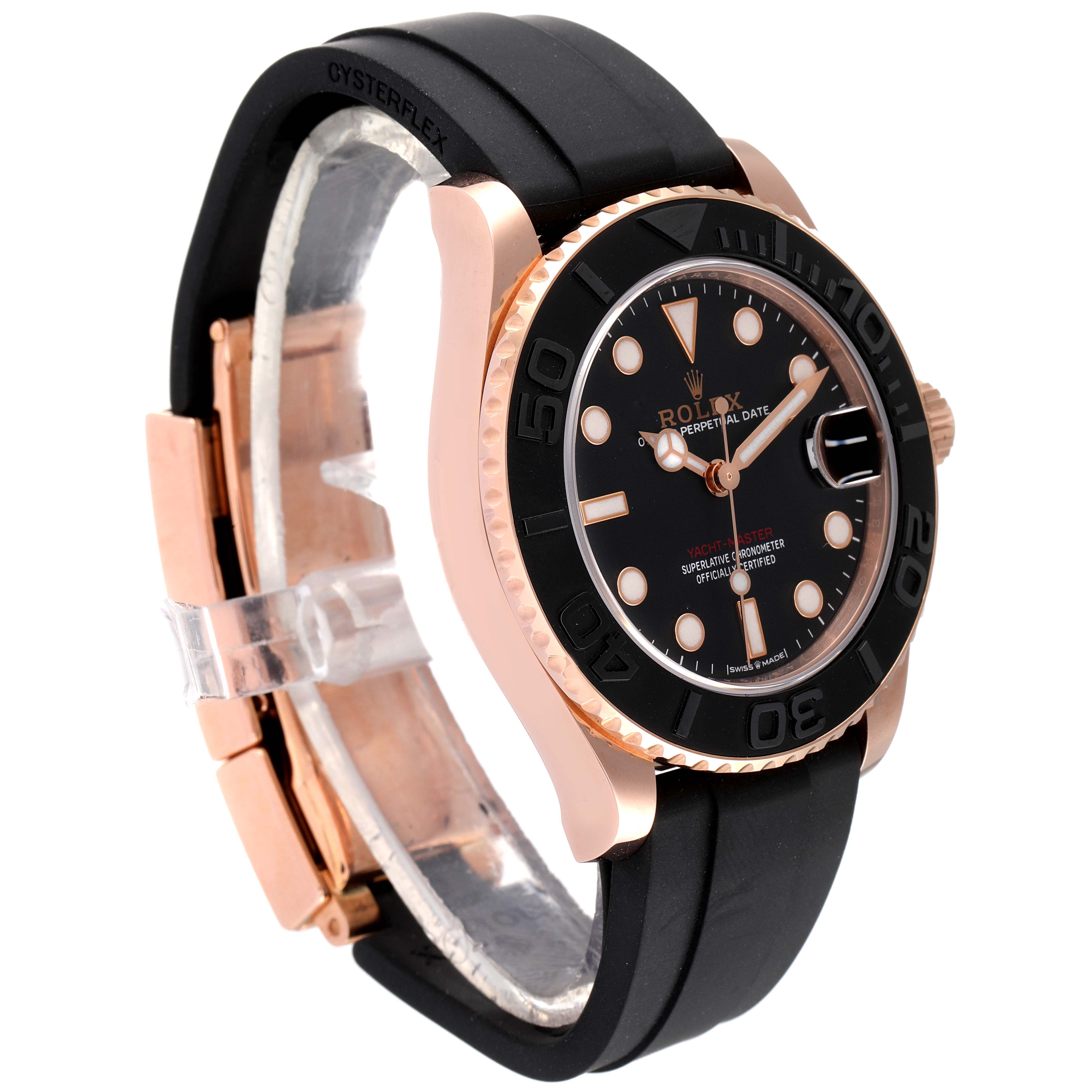The Rolex Yacht-Master 268655 Men
s Rose Gold Black Dial 268655 Men
s Rose Gold Black Dial watch is shown from a side angle, highlighting its black rubber strap, black dial, and rose gold casing.