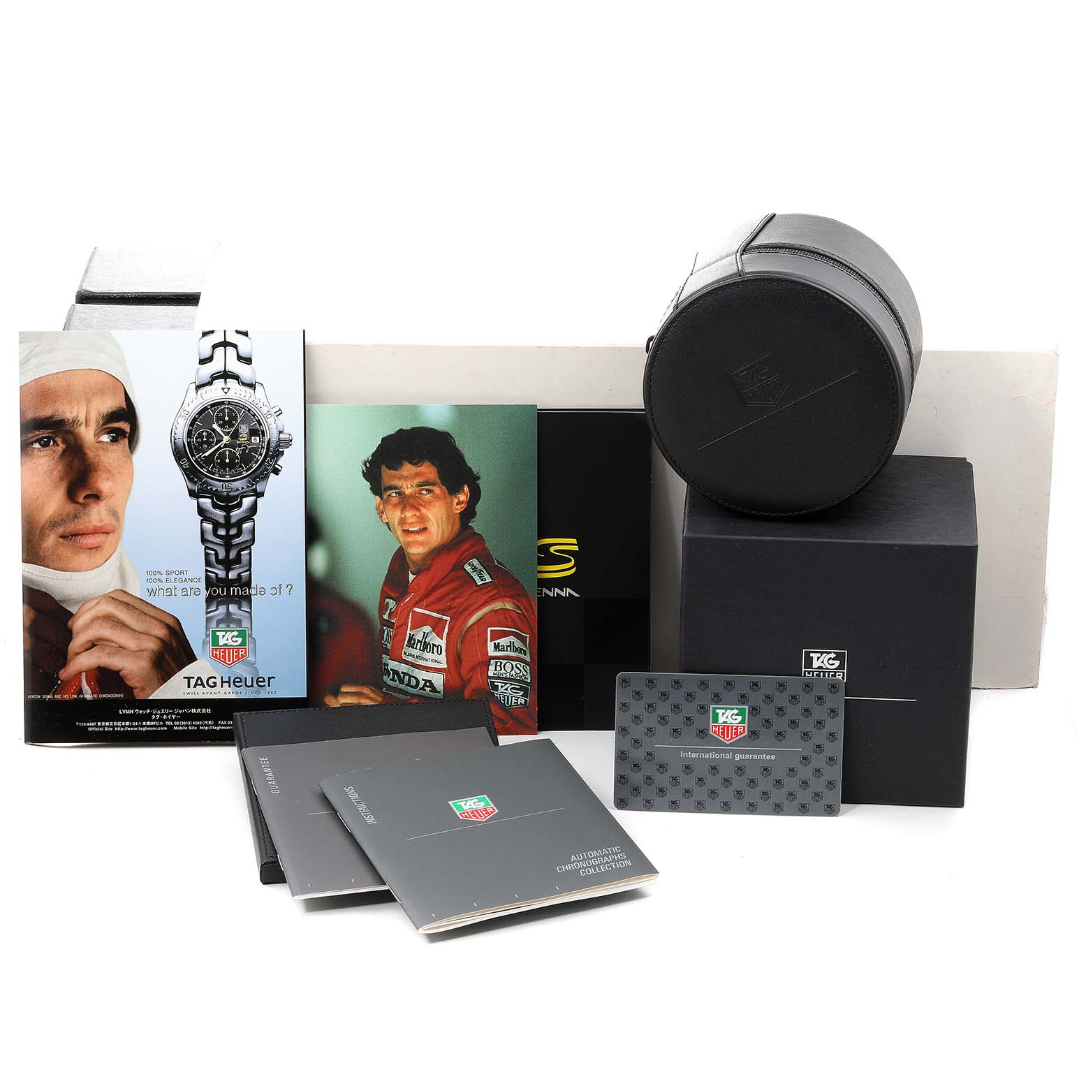 This image shows the packaging, manuals, advertisement materials, and an international guarantee card for the Tag Heuer Link CT2115 Men's Stainless Steel Black Dial CT2115 Men's Stainless Steel Black Dial watch model.