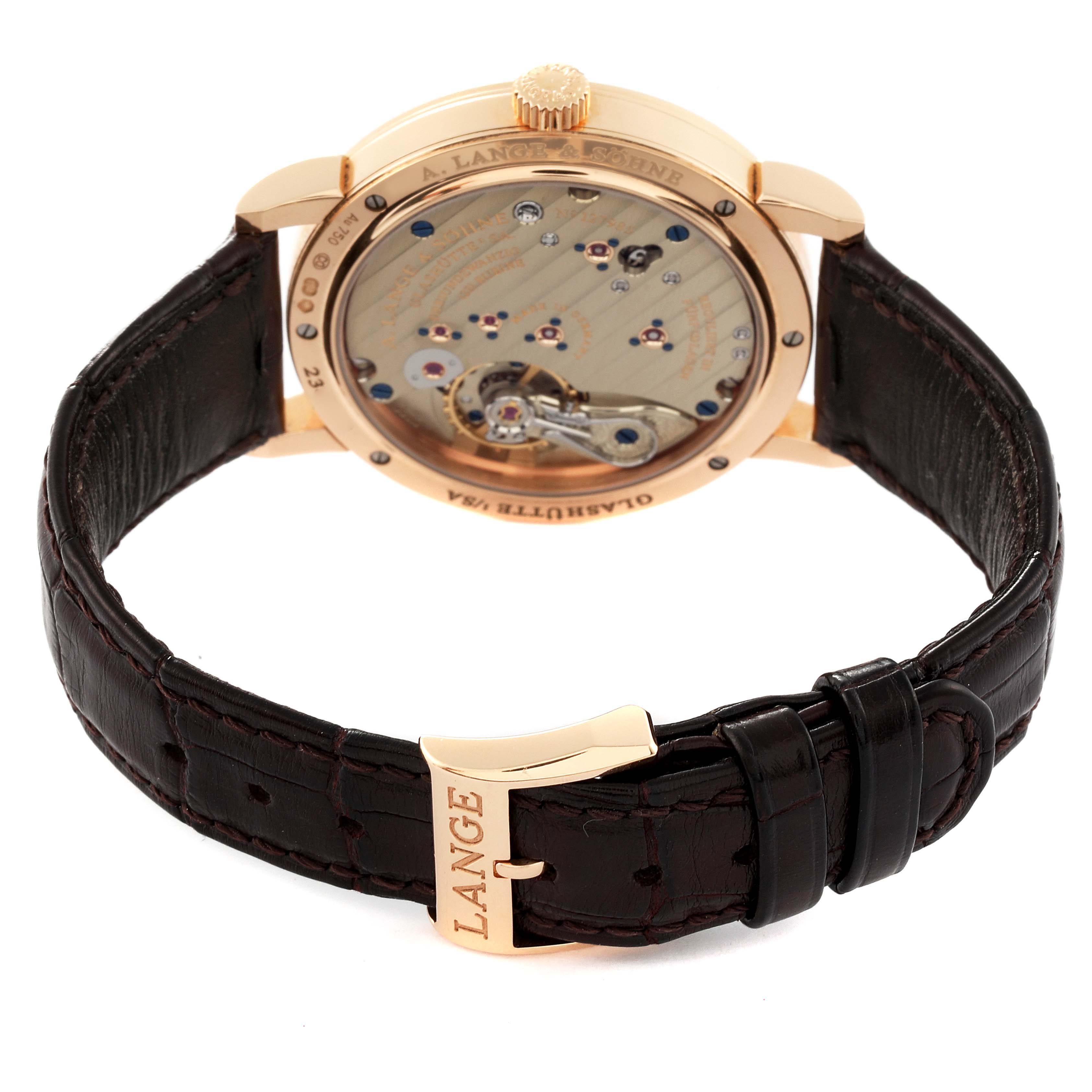 This image shows the back and strap of the 1815 model by A. Lange & Söhne, highlighting the intricate movement and leather strap.