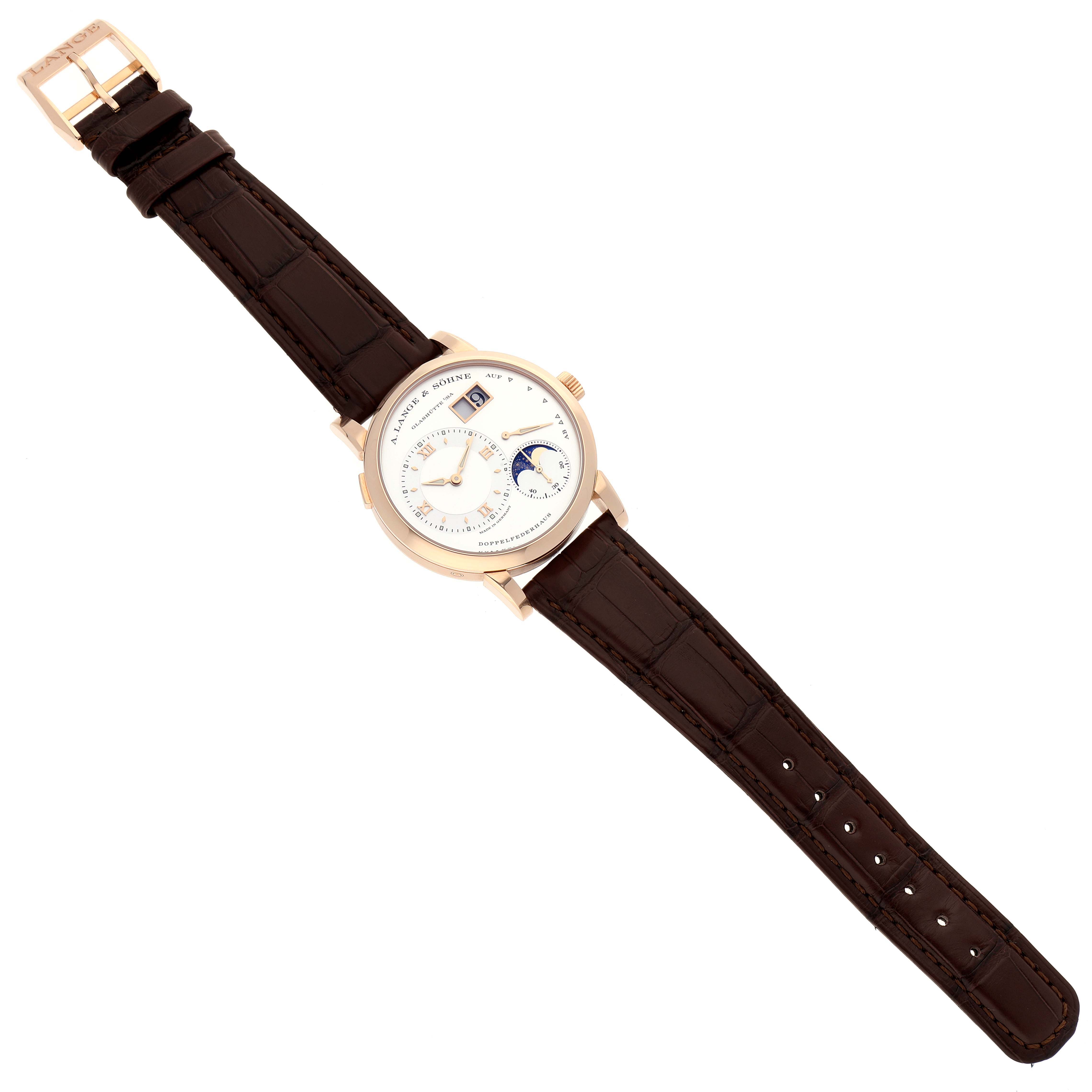 The image shows a Lange 1 model by A. Lange & Söhne from a top-down angle, displaying the dial and full brown leather strap.