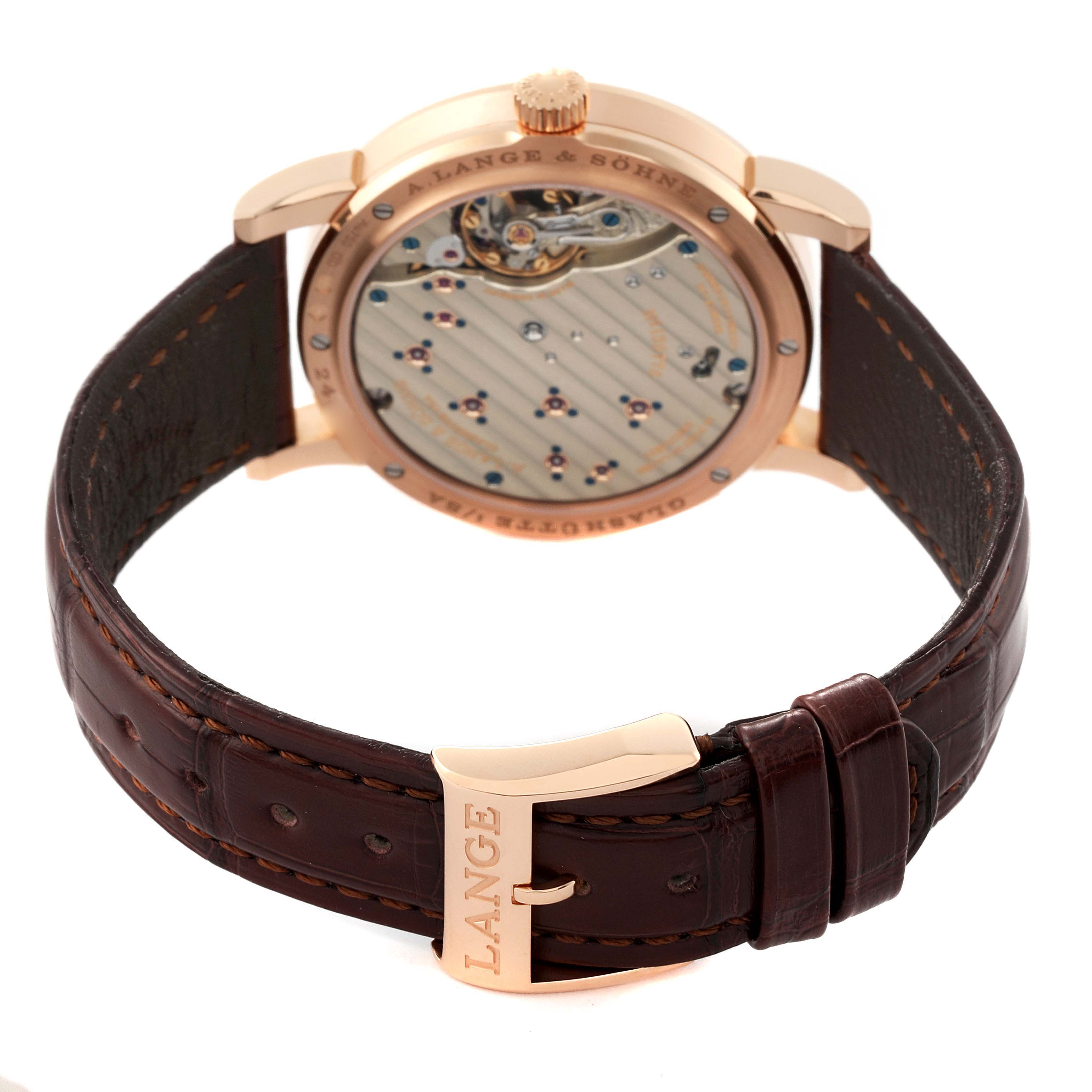 The image shows the back view of the Lange 1 model by A. Lange & Söhne, highlighting the strap and movement.