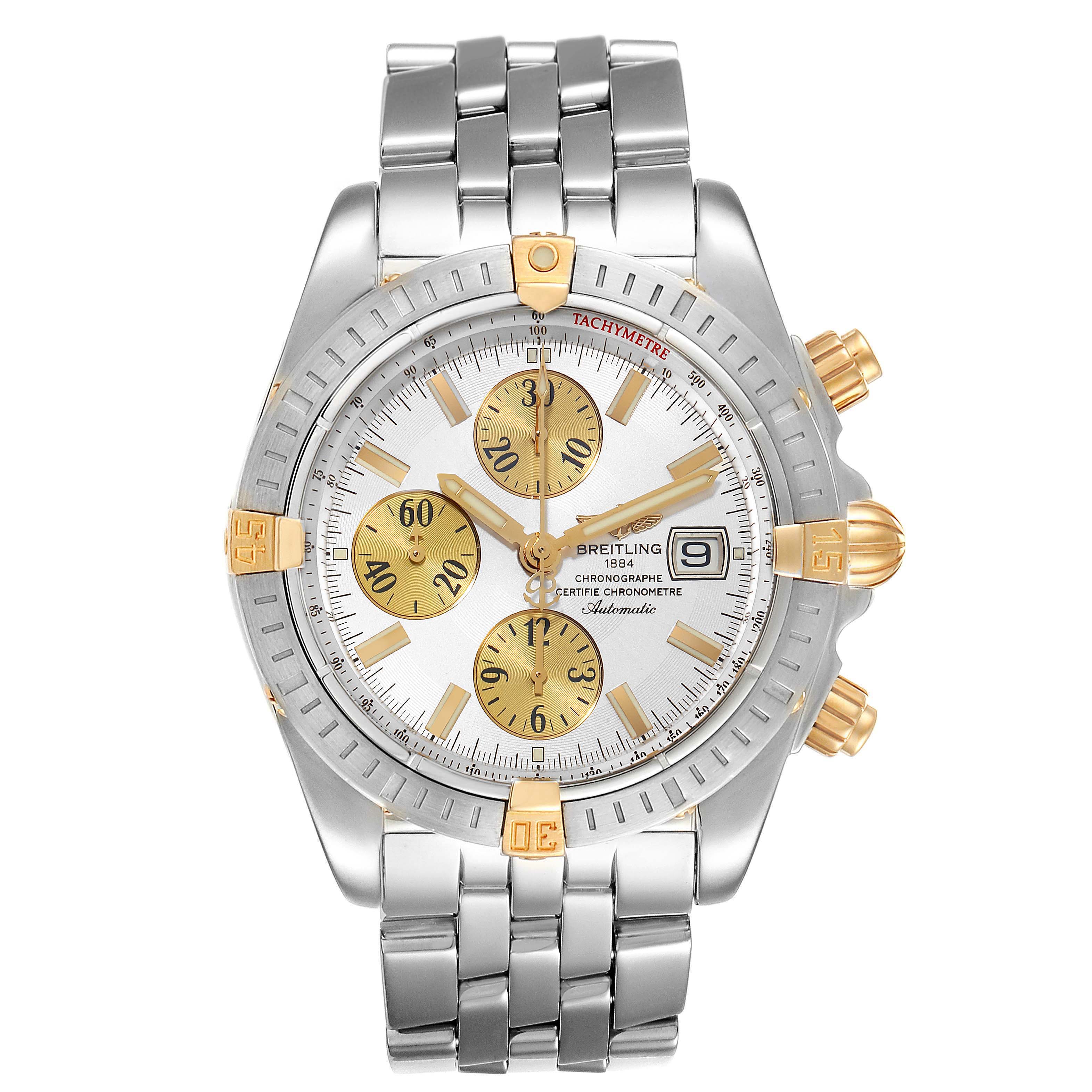 The image shows a front view of a Breitling Chronomat B13356 Men's Steel and Gold (two tone) Silver Dial B13356 Men's Steel and Gold (two tone) Silver Dial watch with a silver and gold bracelet, white dial, and gold subdials.