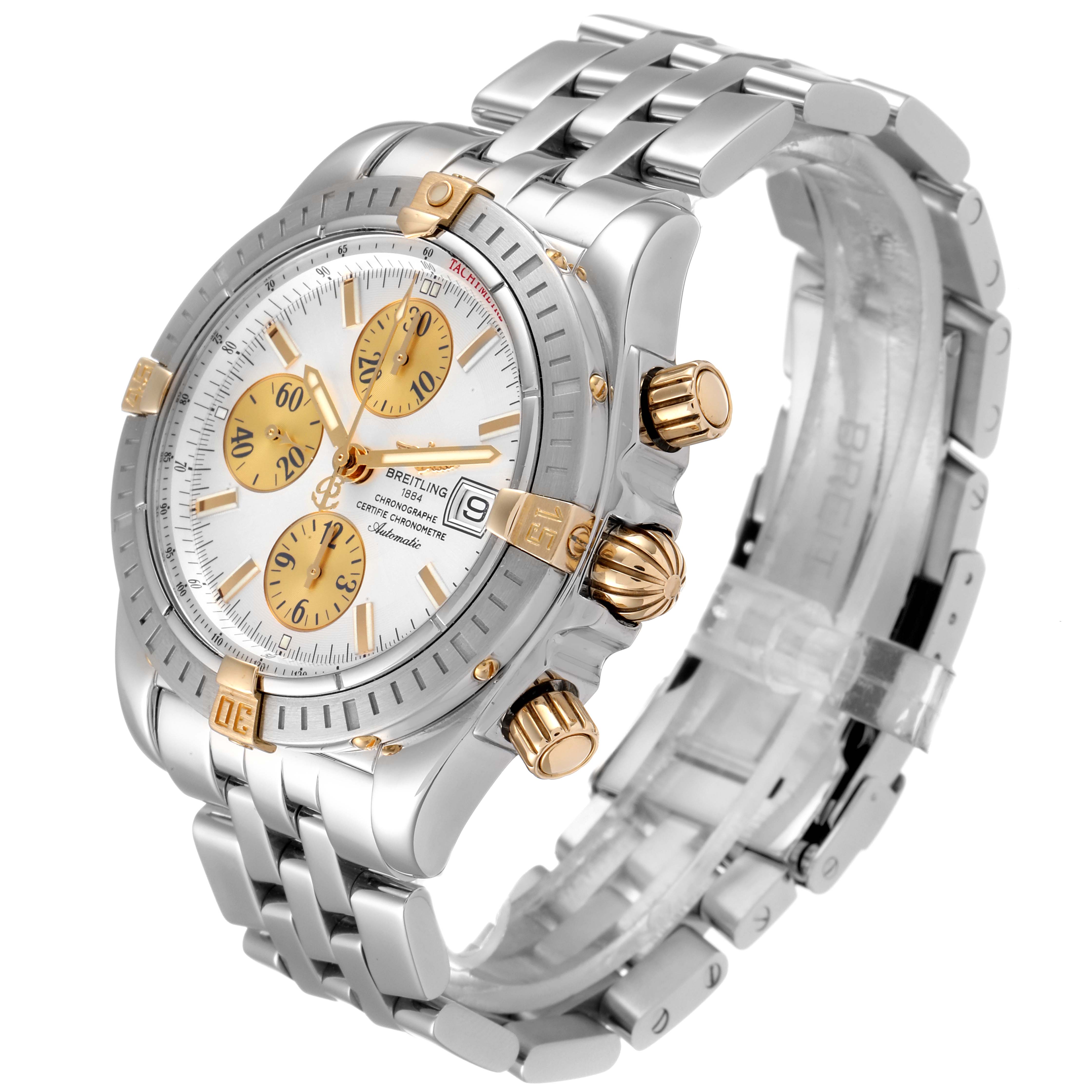 The image shows the Breitling Chronomat B13356 Men's Steel and Gold (two tone) Silver Dial B13356 Men's Steel and Gold (two tone) Silver Dial watch at a three-quarter angle, highlighting its face, bezel, crown, pushers, and bracelet.