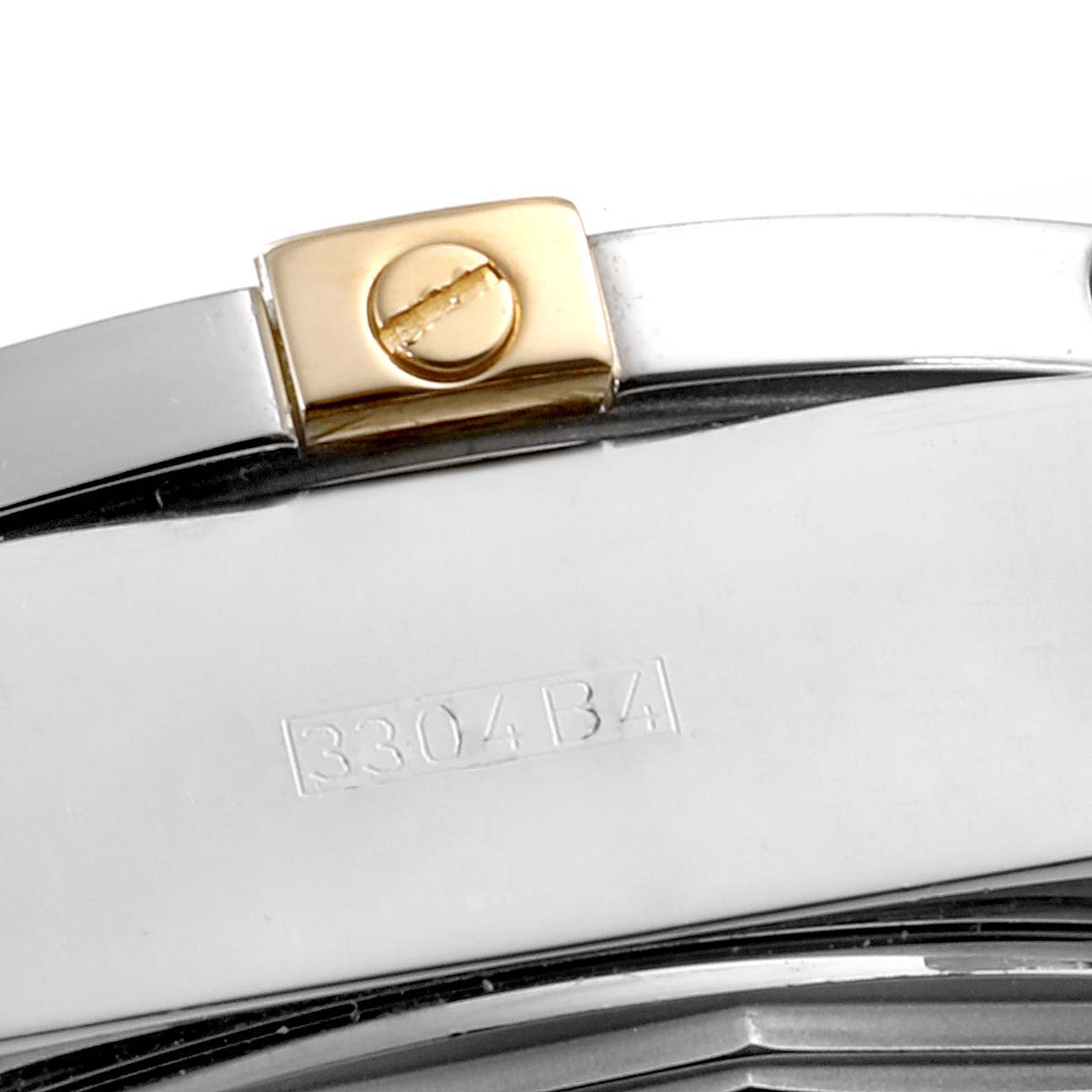 This image shows a close-up of the side of a Breitling Chronomat B13356 Men's Steel and Gold (two tone) Silver Dial B13356 Men's Steel and Gold (two tone) Silver Dial watch, highlighting the crown and model number stamping.