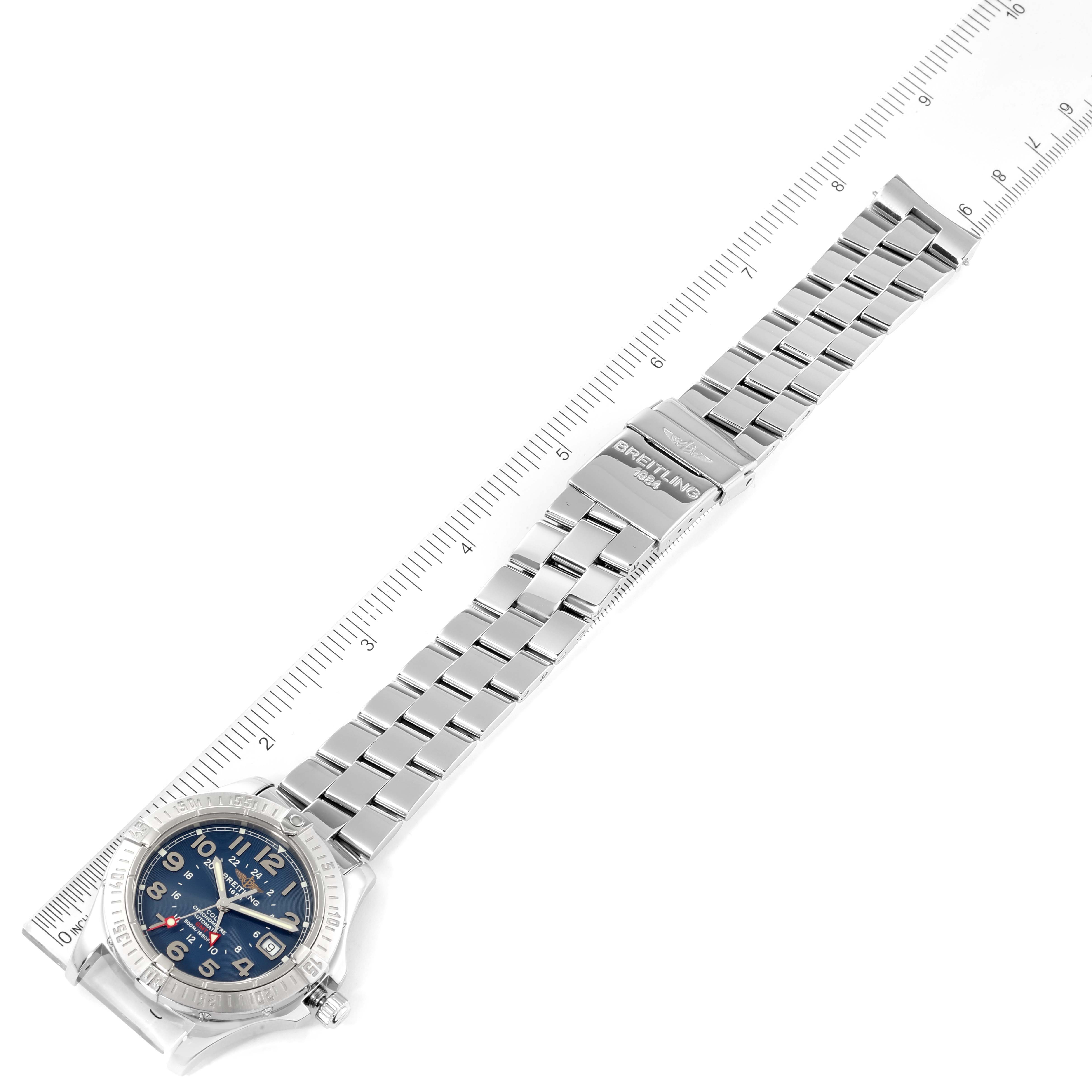 The Breitling Colt A32350 Men's Stainless Steel Blue Dial A32350 Men's Stainless Steel Blue Dial watch is shown from a top view, displaying its face, bezel, and stainless steel bracelet with a ruler for scale.