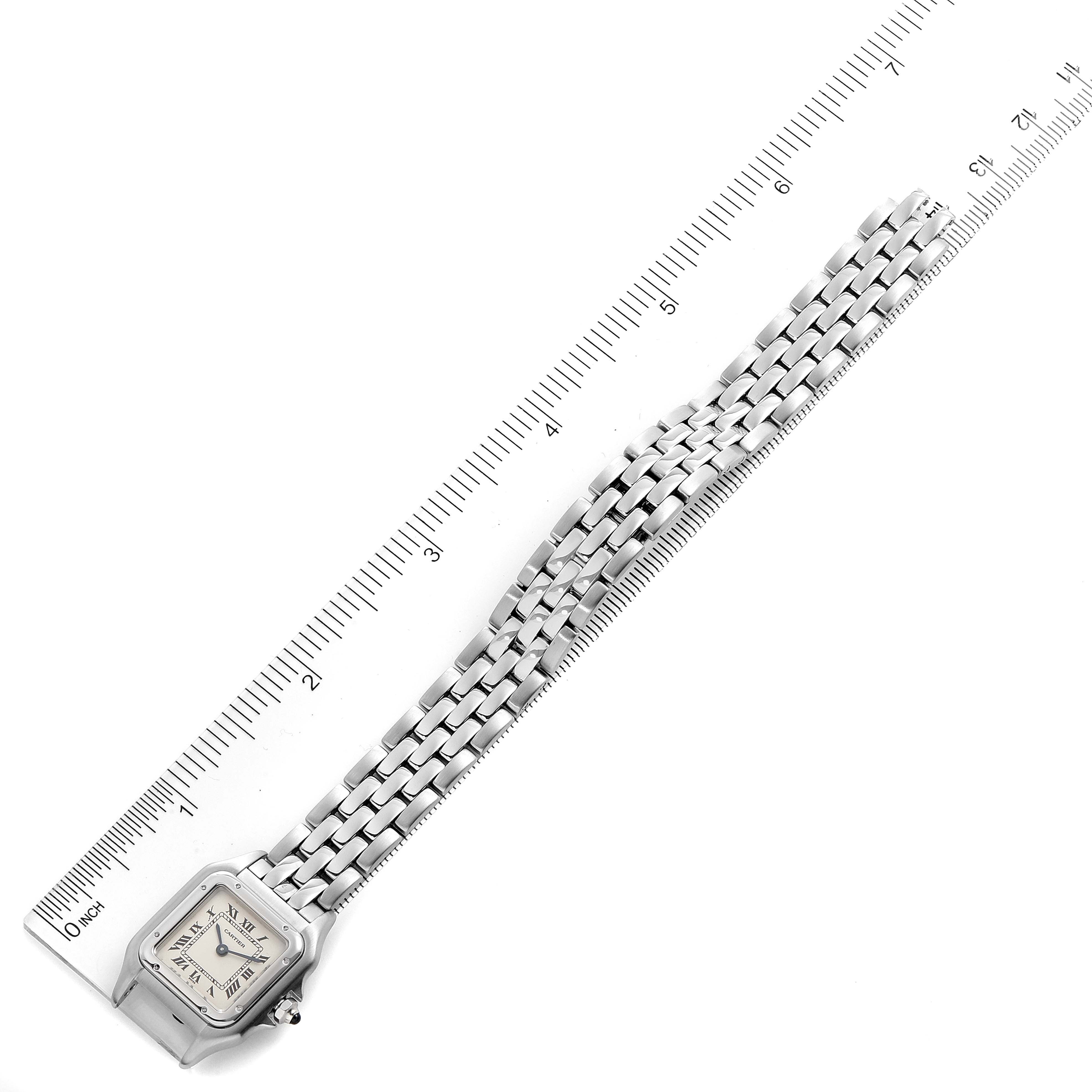 The image shows the Cartier Panthere W25033P5 Women
s Stainless Steel Silver Dial W25033P5 Women
s Stainless Steel Silver Dial watch laid flat against a ruler, demonstrating the band and face from an overhead angle.