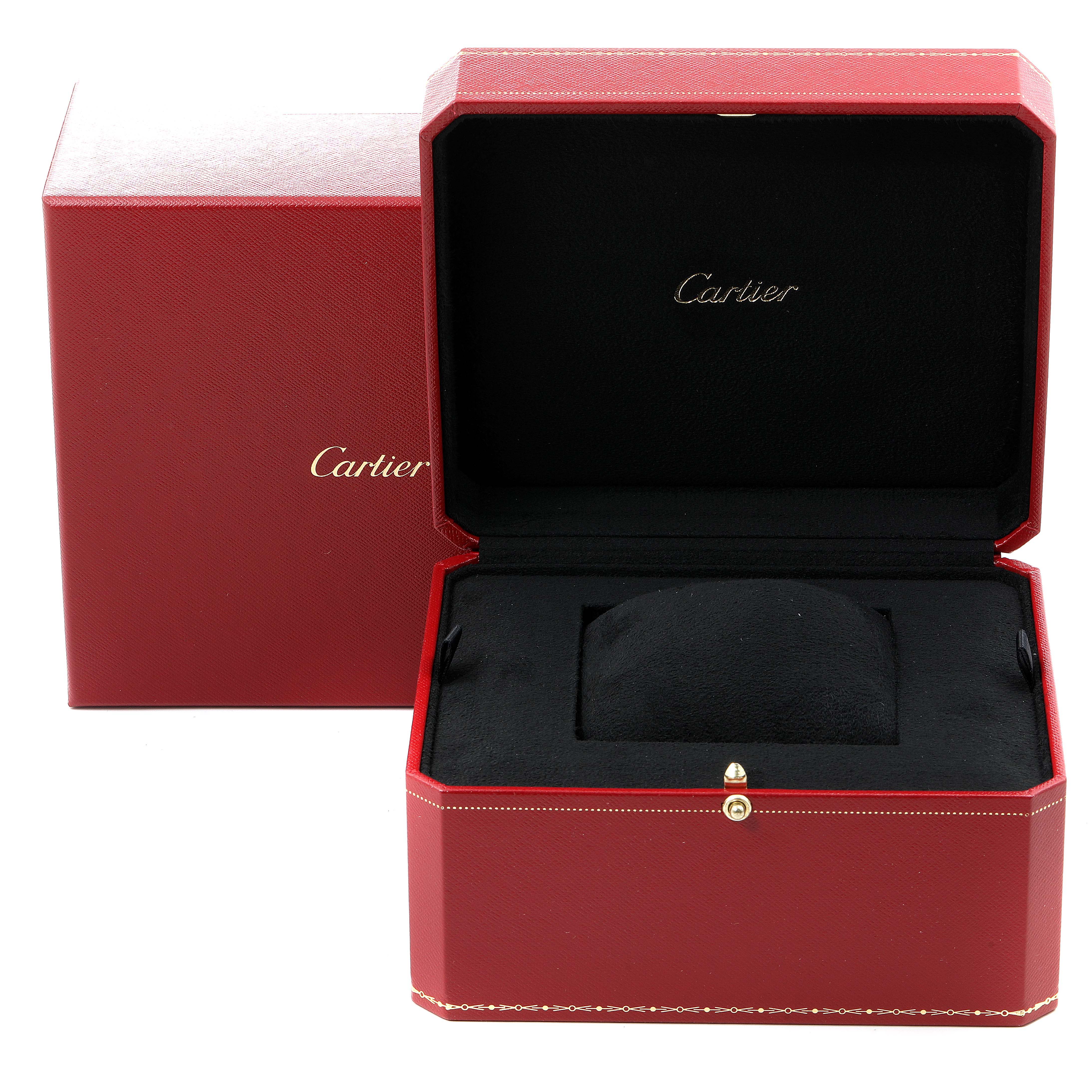 This image shows an open red Cartier box designed for the Santos Dumont model watch, with "Cartier" branding visible inside and outside.