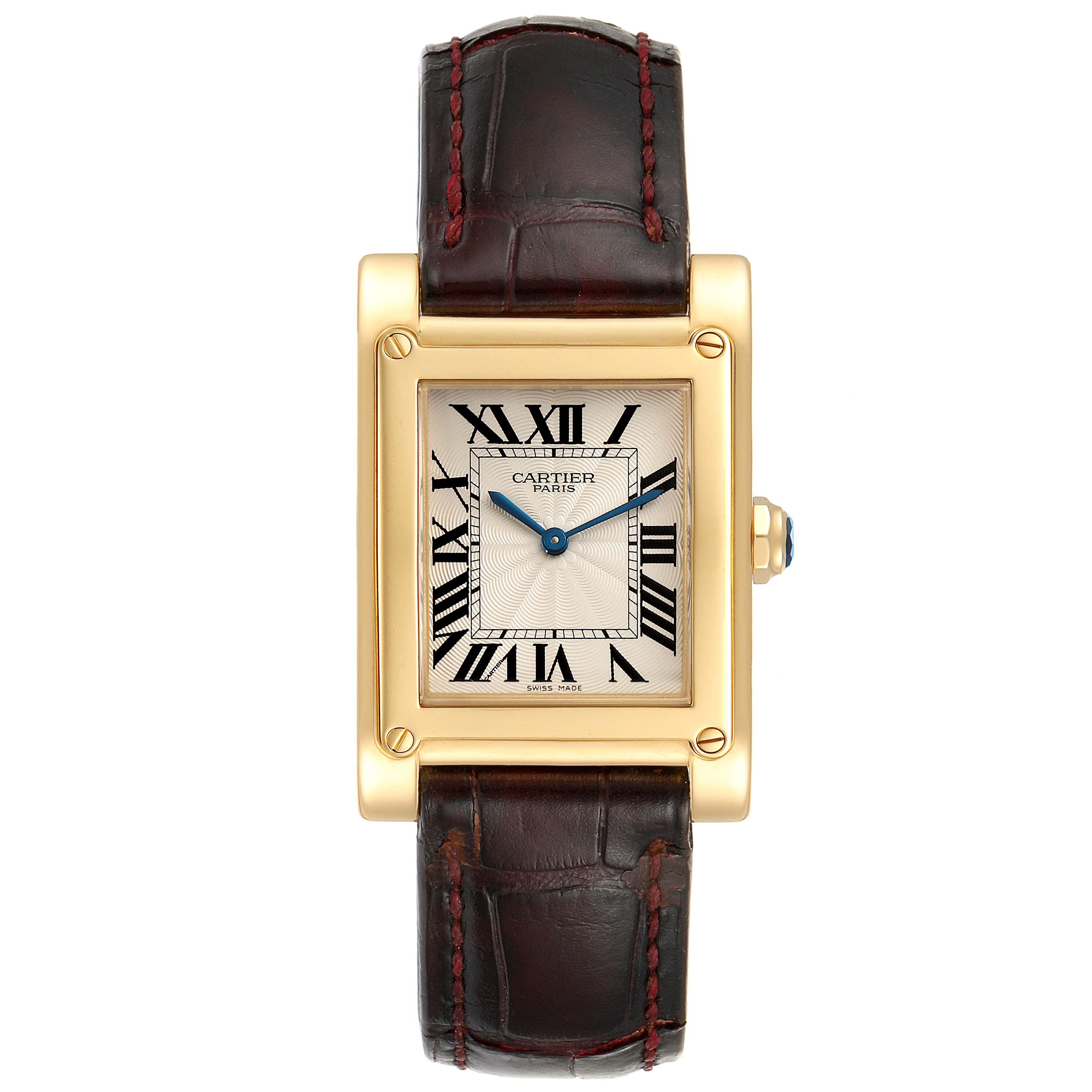 The Cartier Tank A Vis W1539951 Men's Yellow Gold Silver Dial W1539951 Men's Yellow Gold Silver Dial watch is viewed from the front, displaying its rectangular face, Roman numerals, and leather strap.