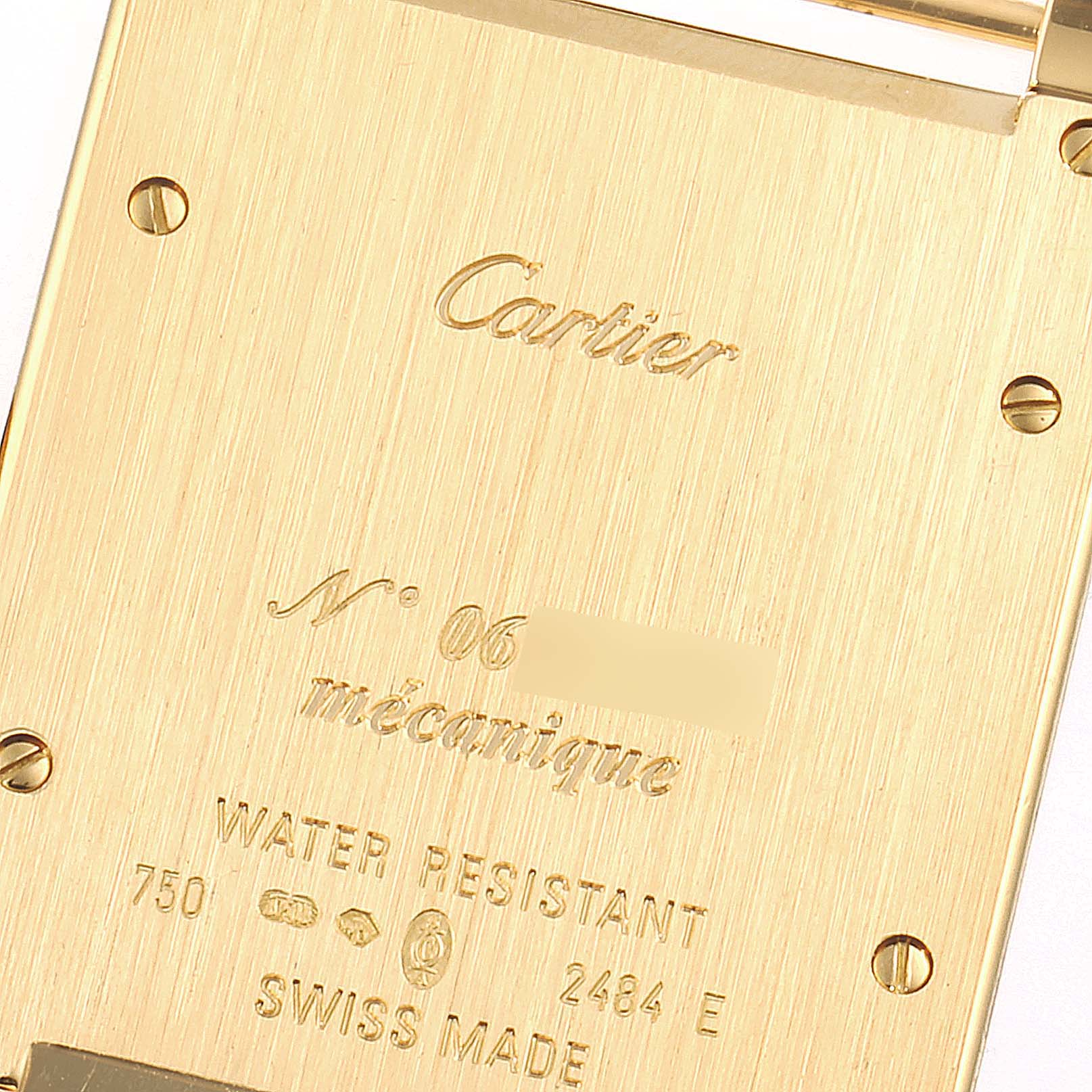 This is a close-up of the back case of the Cartier Tank A Vis W1539951 Men's Yellow Gold Silver Dial W1539951 Men's Yellow Gold Silver Dial watch, showing engravings and screw details.
