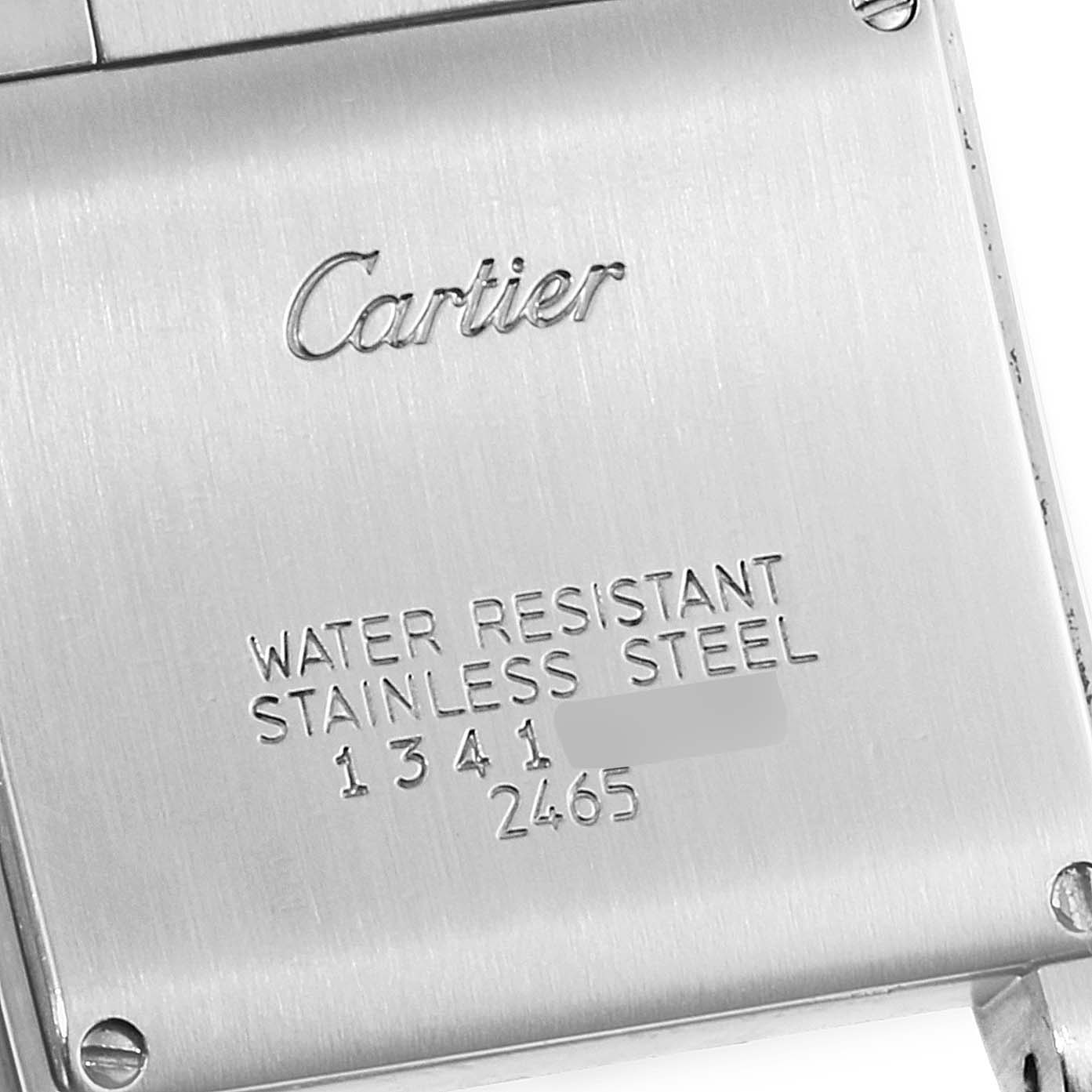 The image shows the back case of a Cartier Tank Française watch, highlighting its water-resistant stainless steel feature.