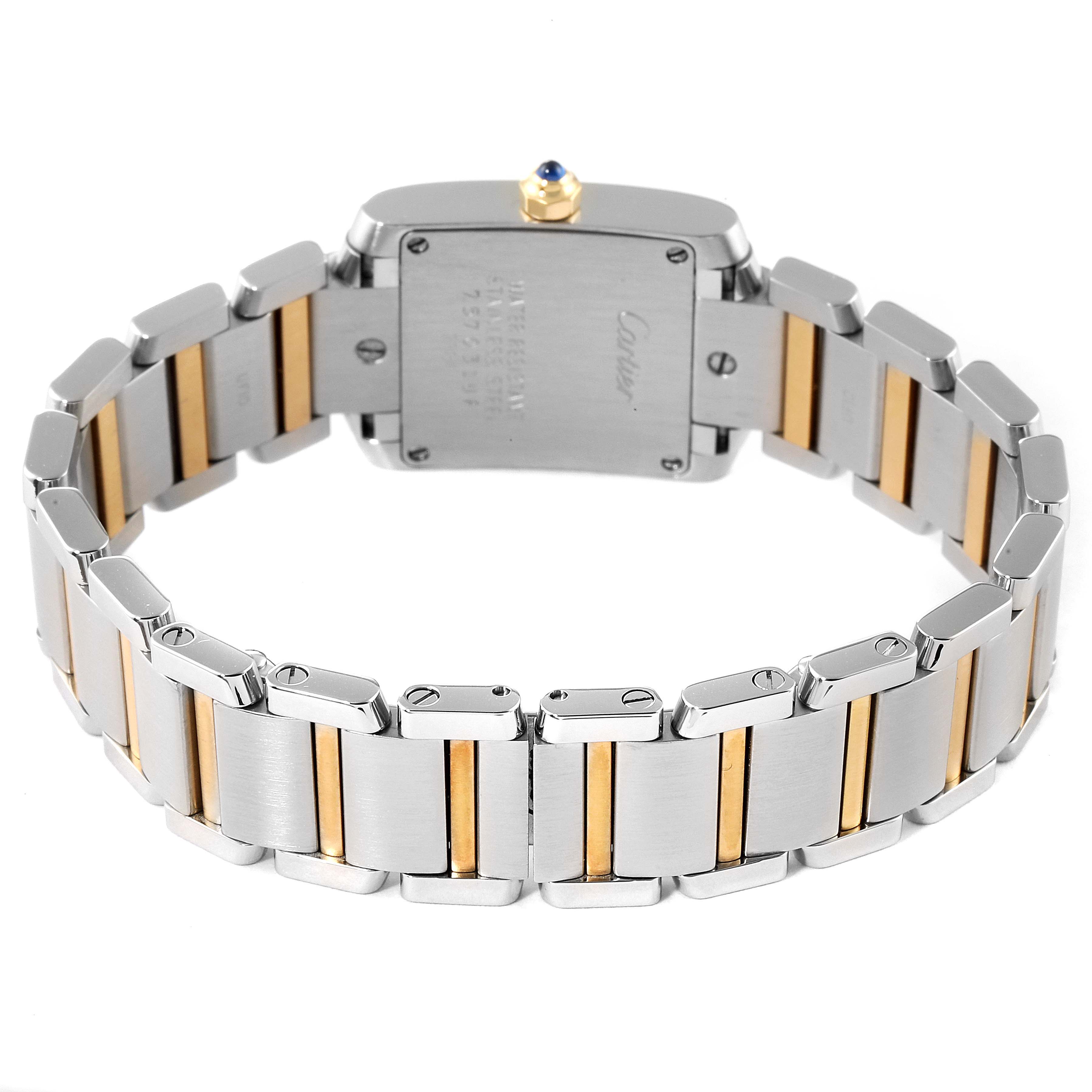 The image shows the back view of a Cartier Tank Francaise W51007Q4 Women's Steel and Gold (two tone) Silver Dial W51007Q4 Women's Steel and Gold (two tone) Silver Dial watch, focusing on the caseback and the two-tone metal bracelet.