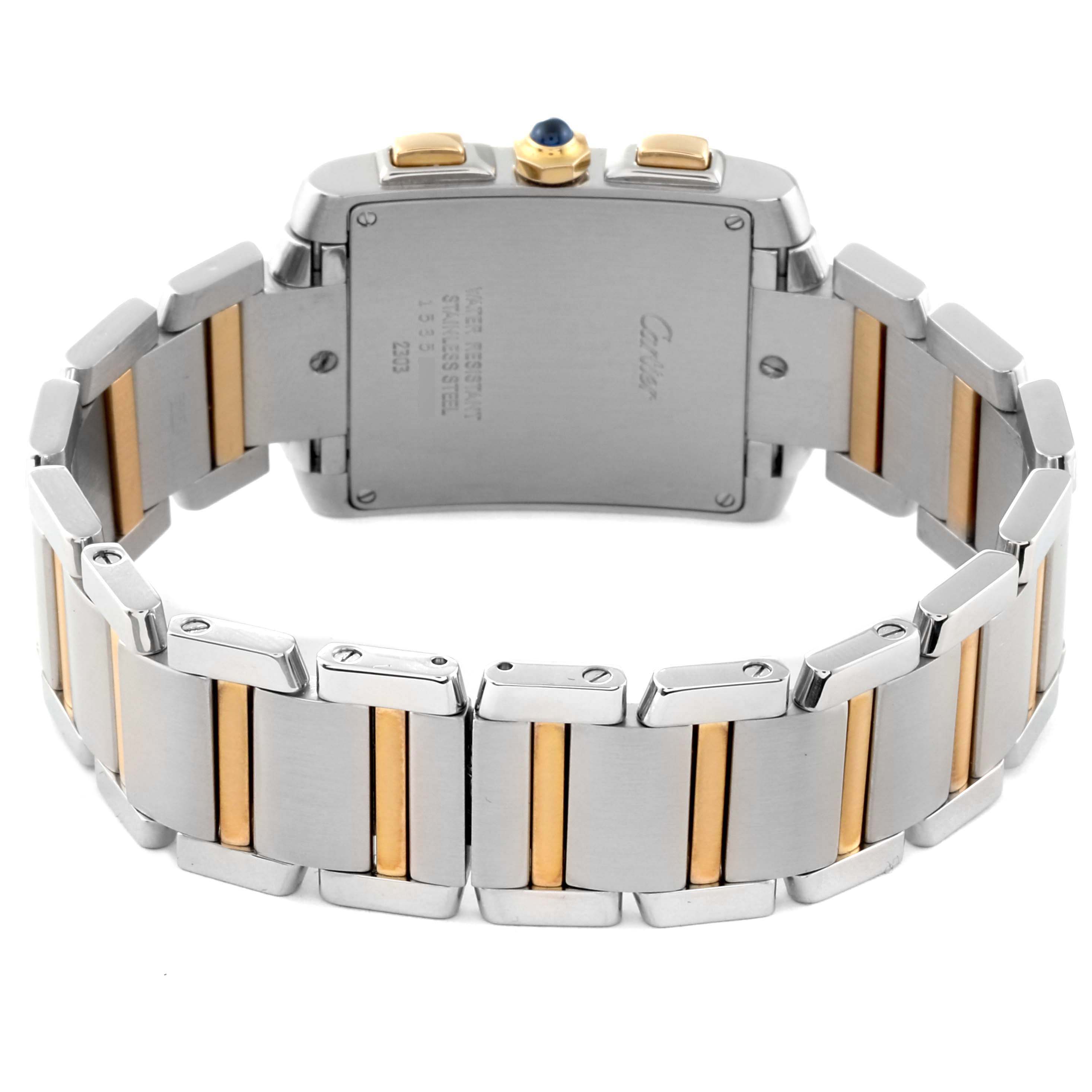 The image shows the back case and bracelet of a Cartier Tank Francaise W51004Q4 Men
s Steel and Gold (two tone) Silver Dial W51004Q4 Men
s Steel and Gold (two tone) Silver Dial watch, with a partial focus on its two-tone metal links.