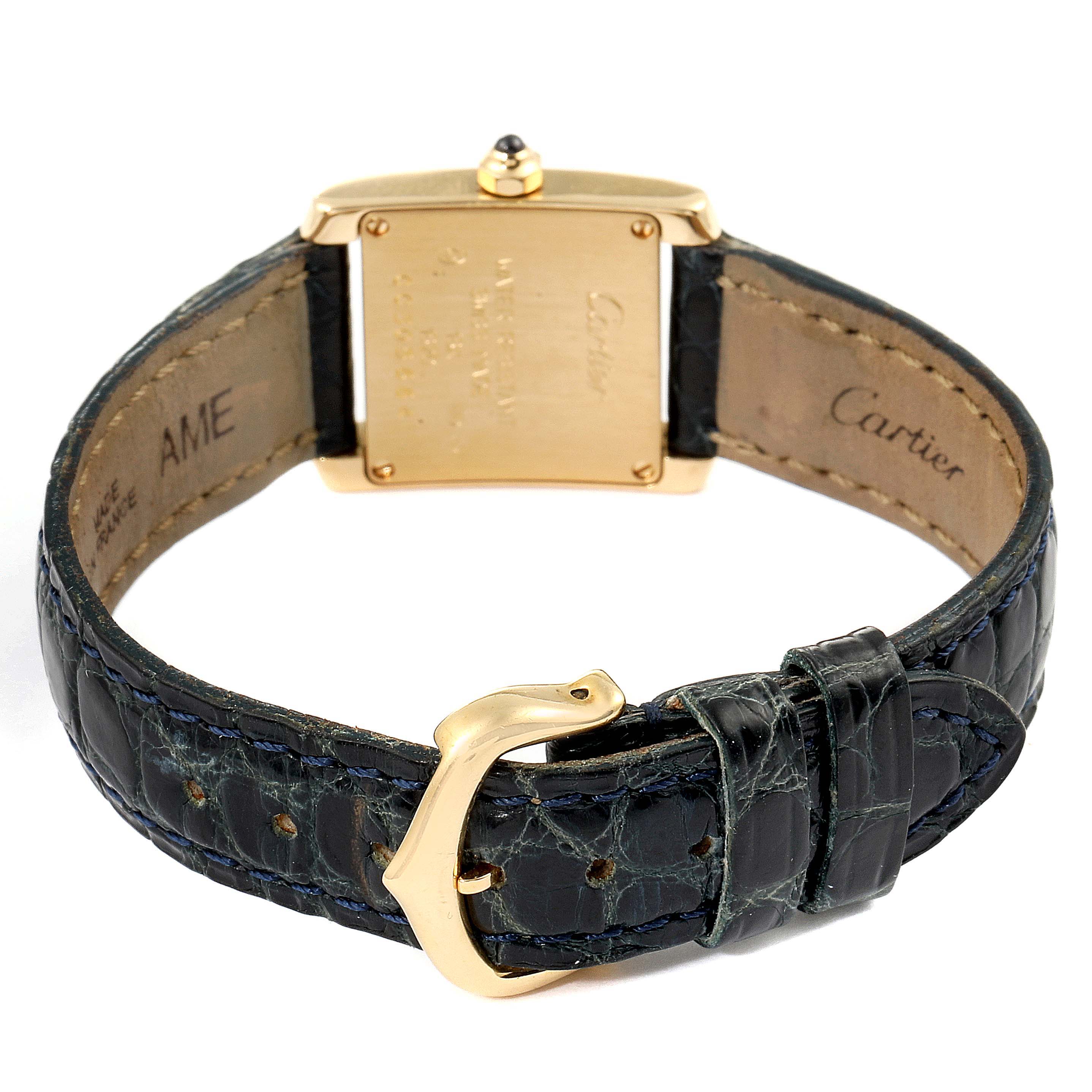 The image shows the back view of the Cartier Tank Française watch, highlighting the leather strap, buckle, and case back.