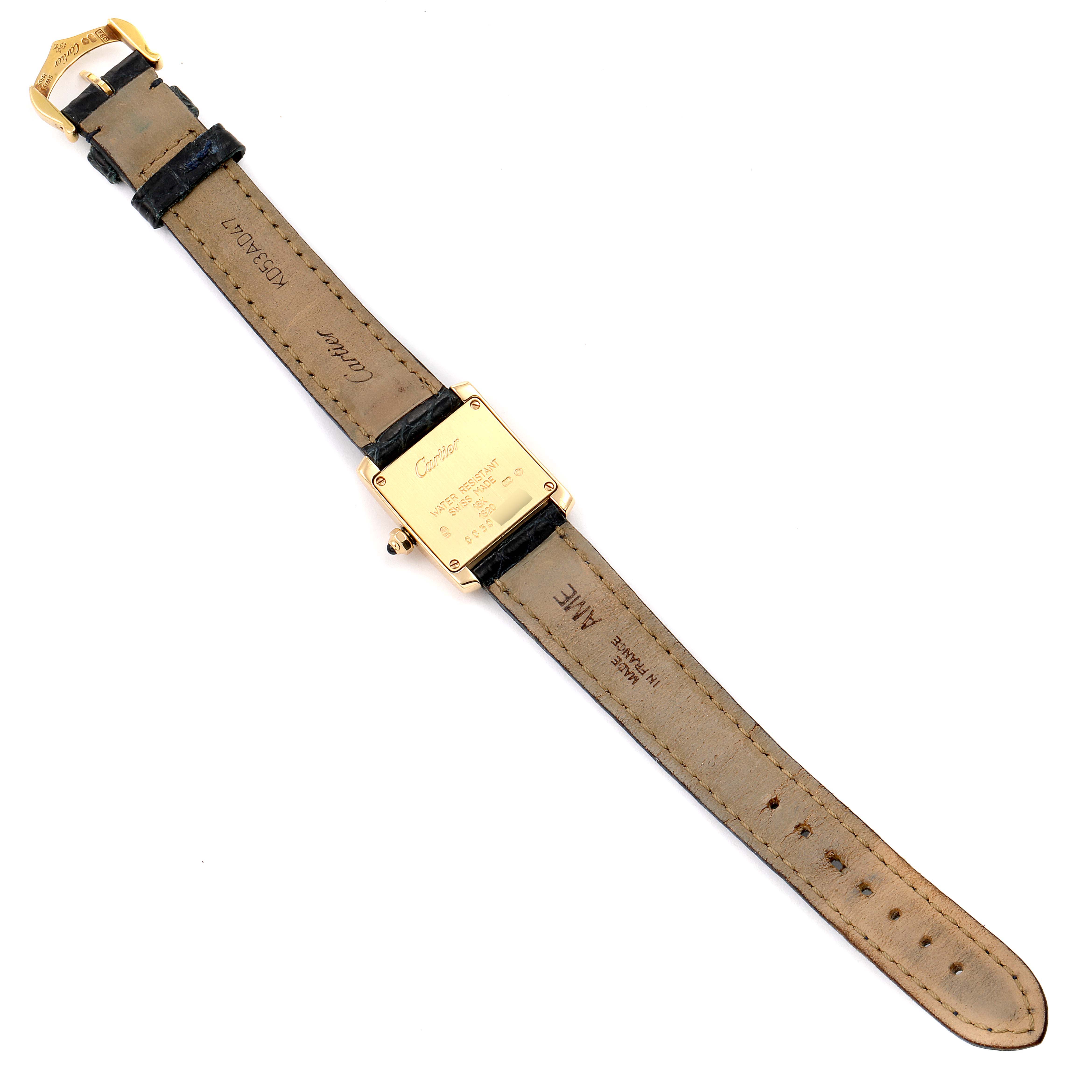 The image shows the back view of a Cartier Tank Française watch, displaying the rear of the case and the leather strap.