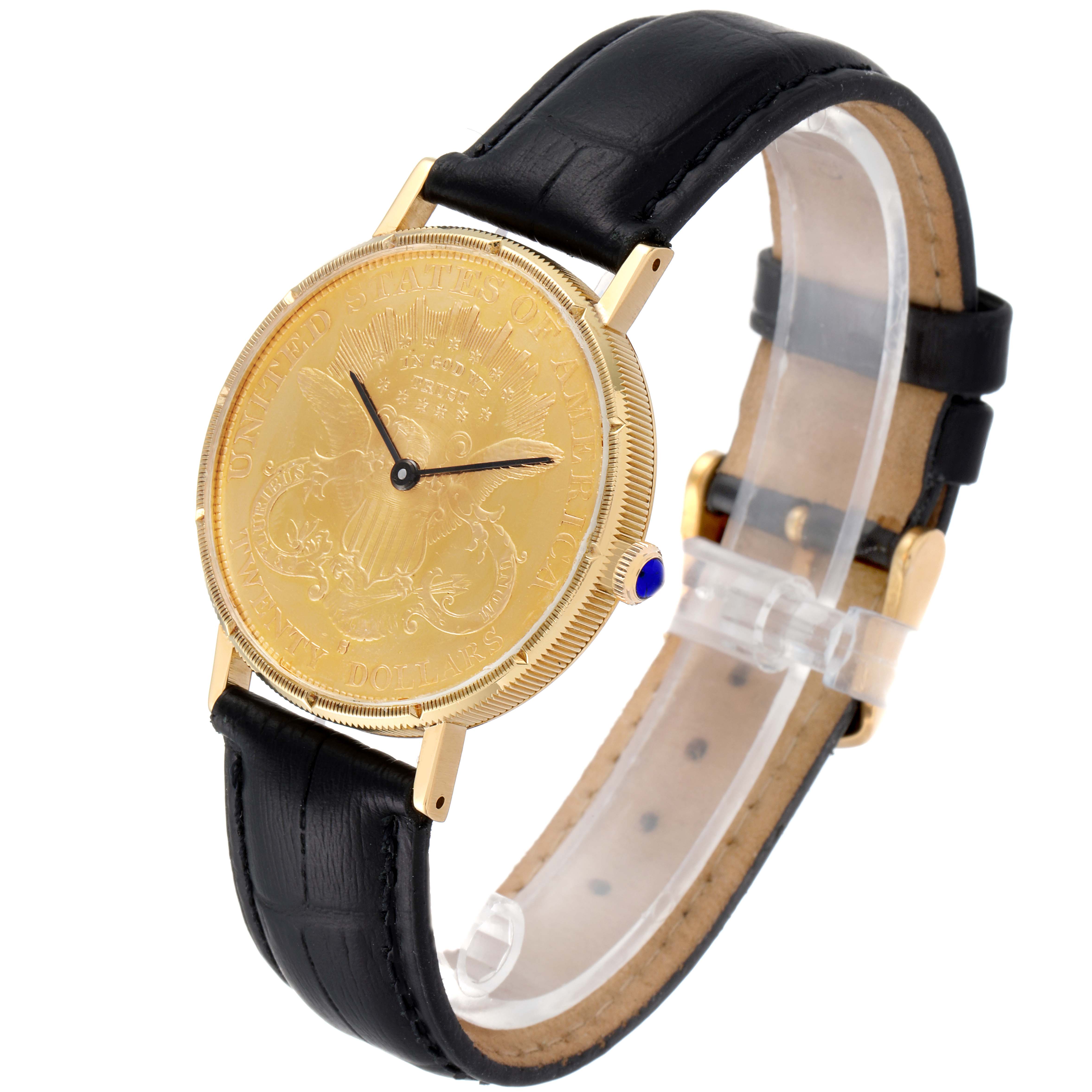 The image shows a Baume & Mercier  Men's Yellow Gold Black Dial  Men's Yellow Gold Black Dial 1873 model watch angled from the front and slightly to the left, revealing the gold coin face and black leather strap.