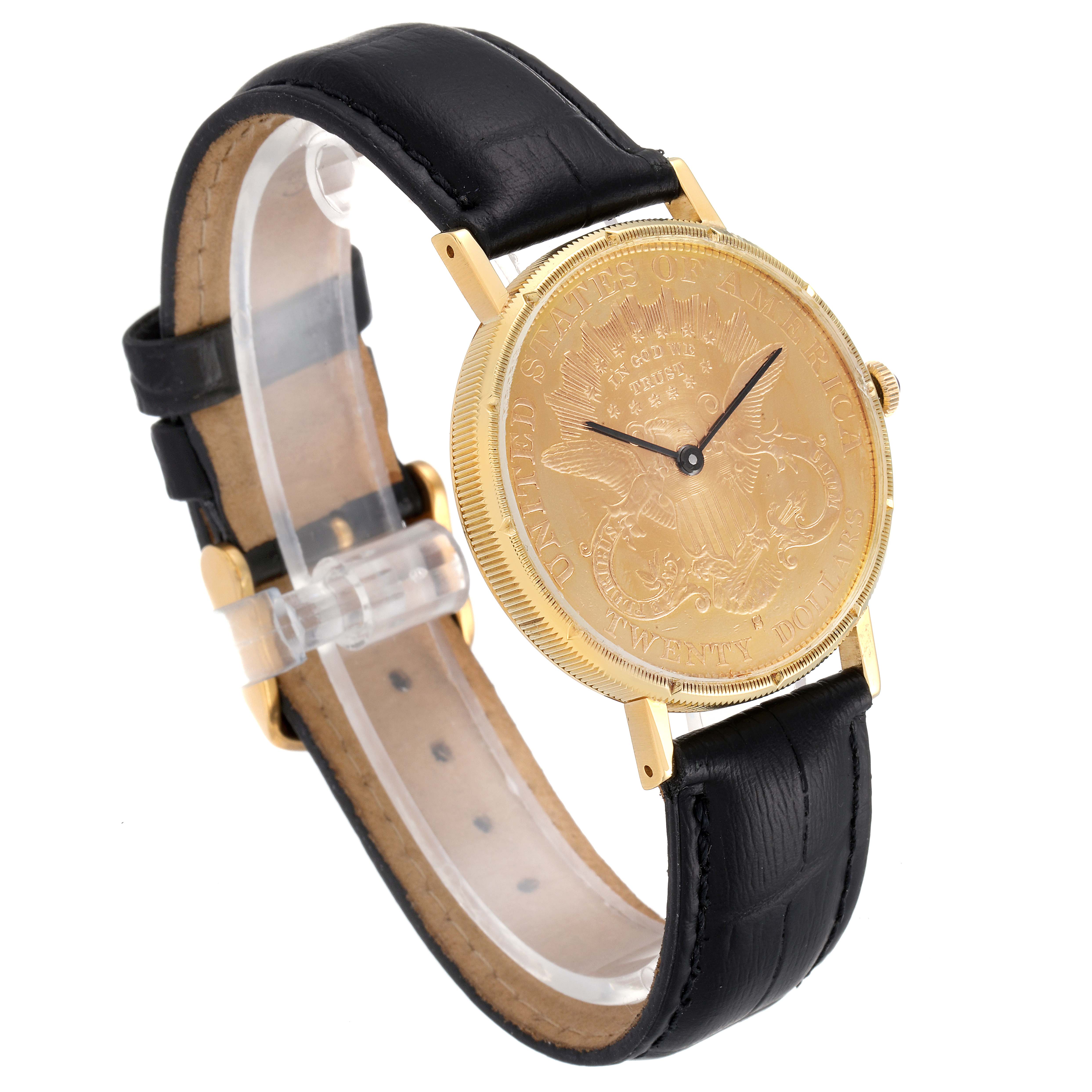 The Baume & Mercier  Men's Yellow Gold Black Dial  Men's Yellow Gold Black Dial 20 Dollars Double Eagle Yellow Gold Coin Automatic Mens Watch 1873 model is shown at a three-quarter angle highlighting its face and black leather strap.