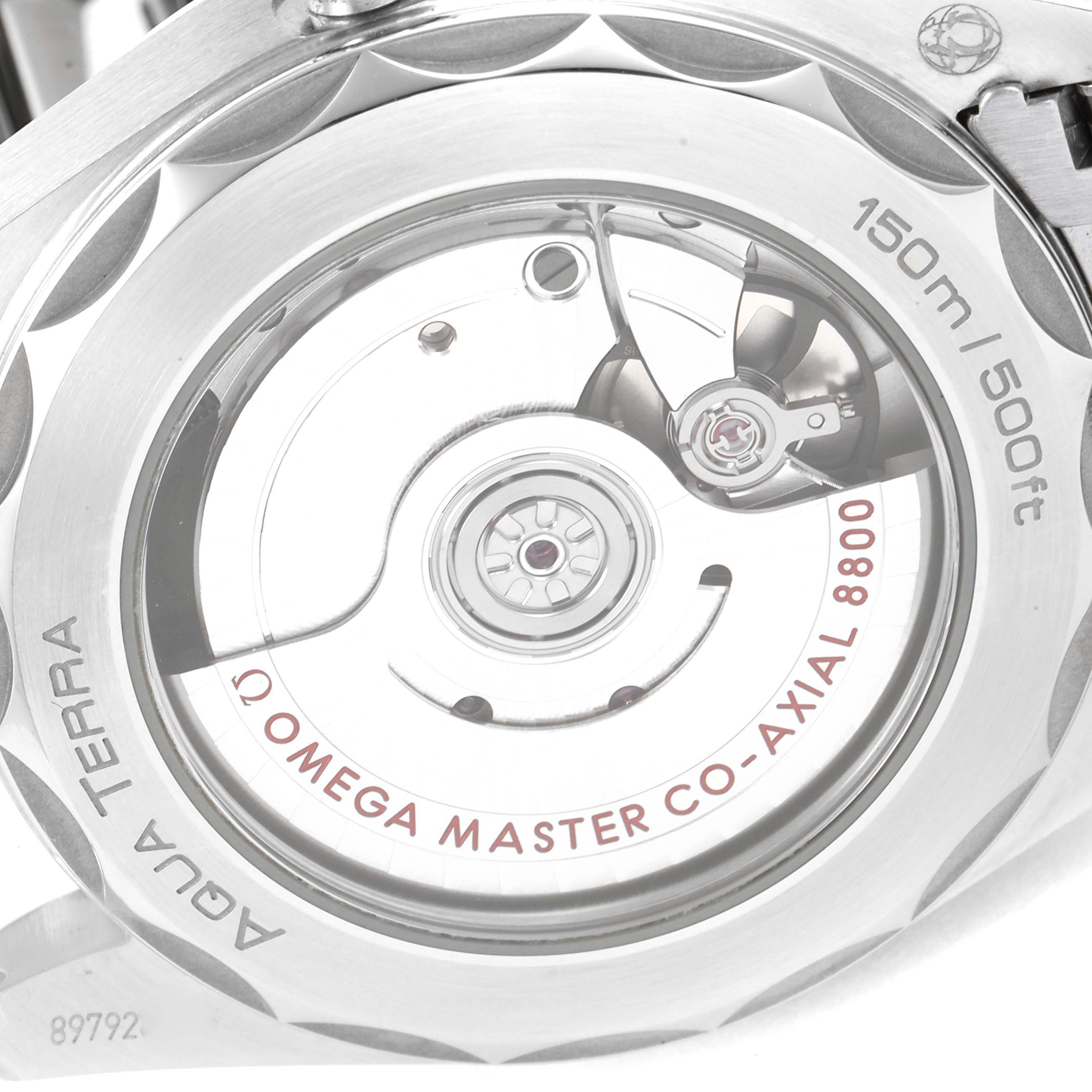 This image shows a close-up view of the back of an Omega Aqua Terra 220.10.38.20.03.002 Men
s Stainless Steel Blue Dial 220.10.38.20.03.002 Men
s Stainless Steel Blue Dial watch, highlighting its Co-Axial 8800 movement.