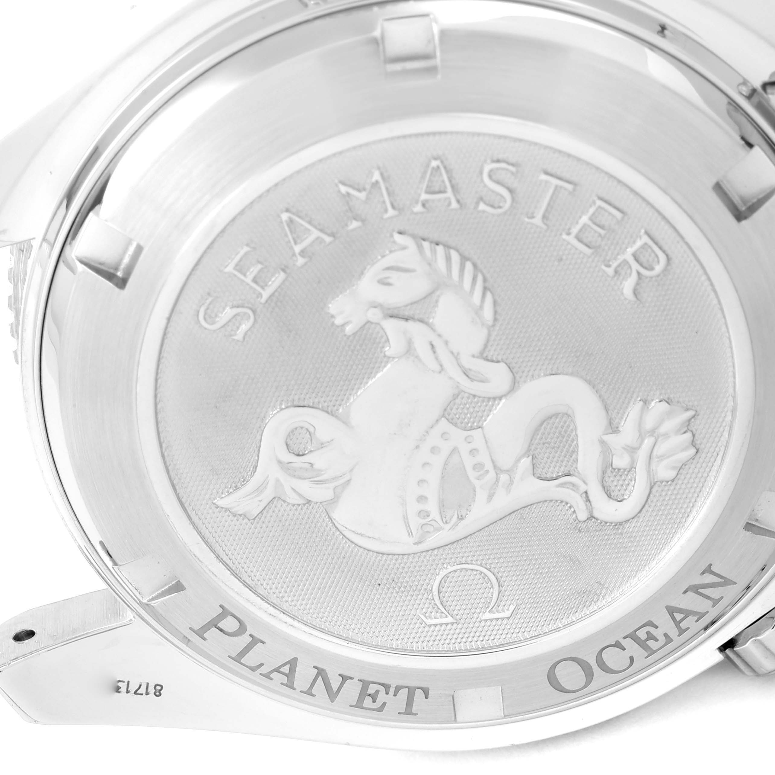 This image shows the case back of an Omega Seamaster Planet Ocean watch, including engravings and the brand logo.