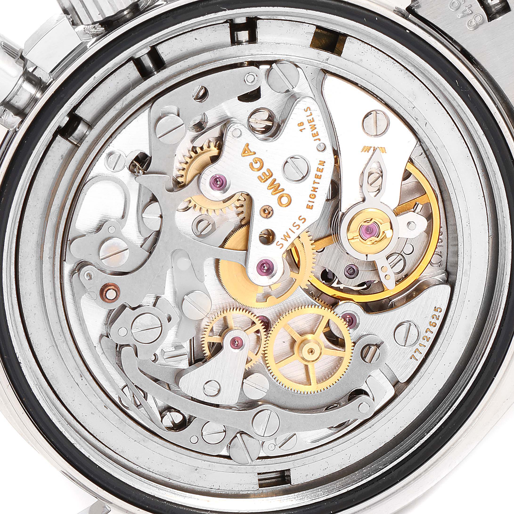 The image shows the intricate inner mechanics and movement of the Omega Speedmaster 3570.50.00 Men
s Stainless Steel Black Dial 3570.50.00 Men
s Stainless Steel Black Dial watch from a close-up, rear angle.