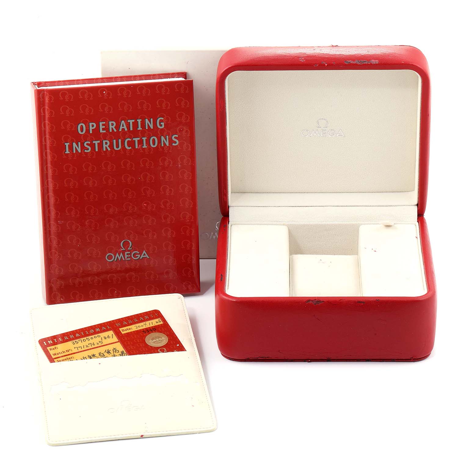 The image shows the packaging, instruction manual, and warranty card for an Omega Speedmaster 3570.50.00 Men
s Stainless Steel Black Dial 3570.50.00 Men
s Stainless Steel Black Dial watch.