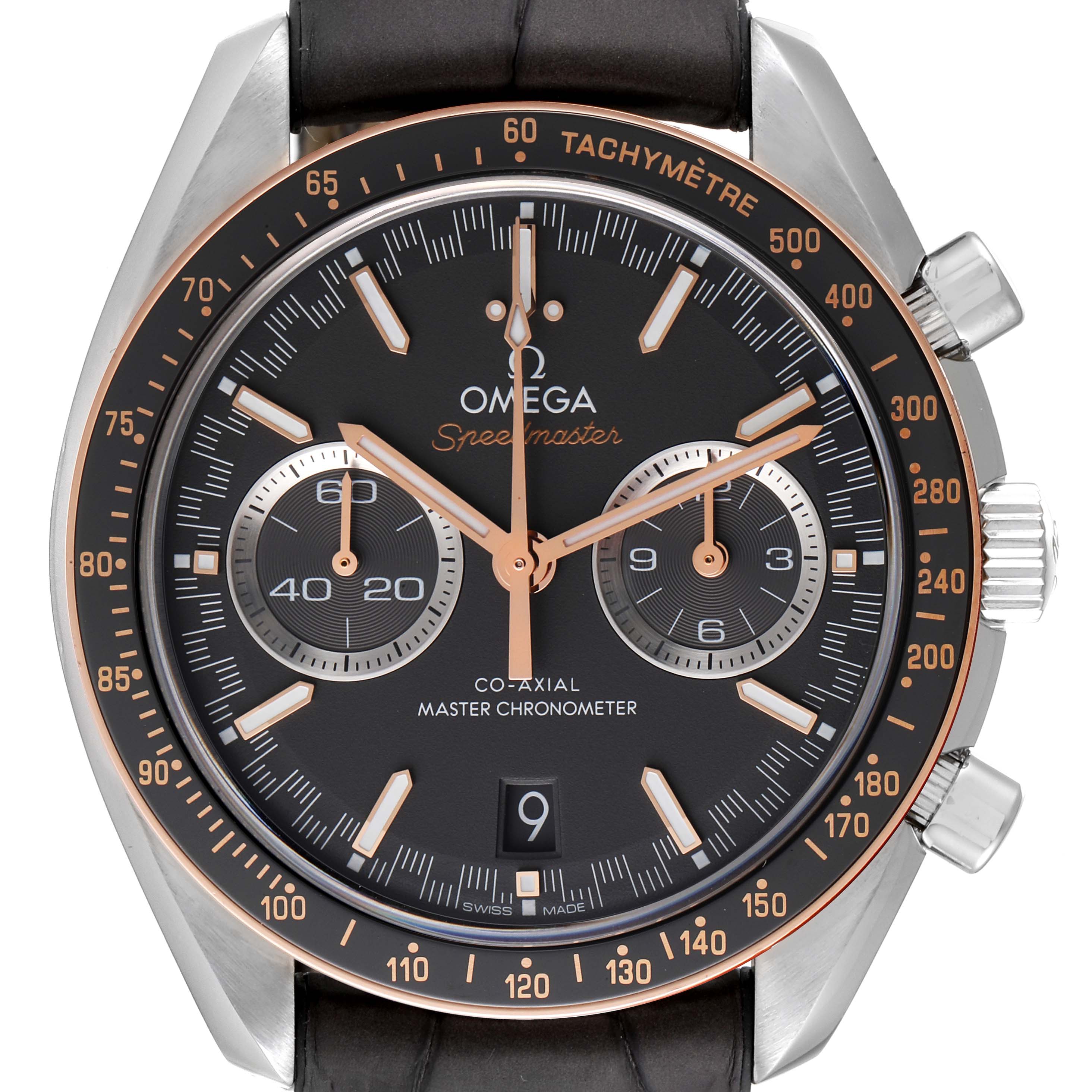 The image shows a close-up of the Omega Speedmaster 329.23.44.51.06.001 Men's Steel and Gold (two tone) Grey Dial 329.23.44.51.06.001 Men's Steel and Gold (two tone) Grey Dial watch face, highlighting the tachymeter, subdials, and crown.