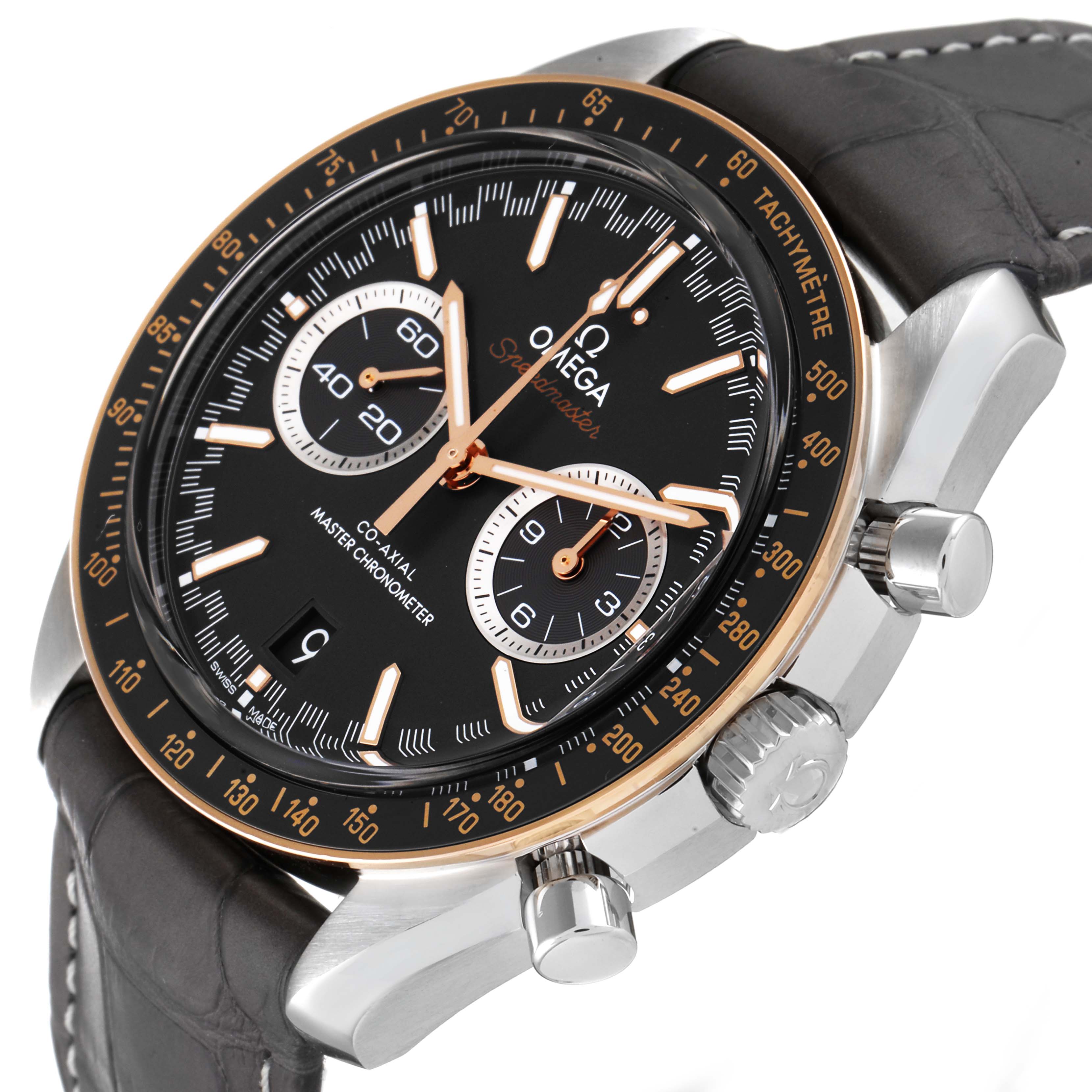 The Omega Speedmaster 329.23.44.51.06.001 Men's Steel and Gold (two tone) Grey Dial 329.23.44.51.06.001 Men's Steel and Gold (two tone) Grey Dial watch is shown at an angle displaying the dial, bezel, chronograph subdials, and part of the leather strap.